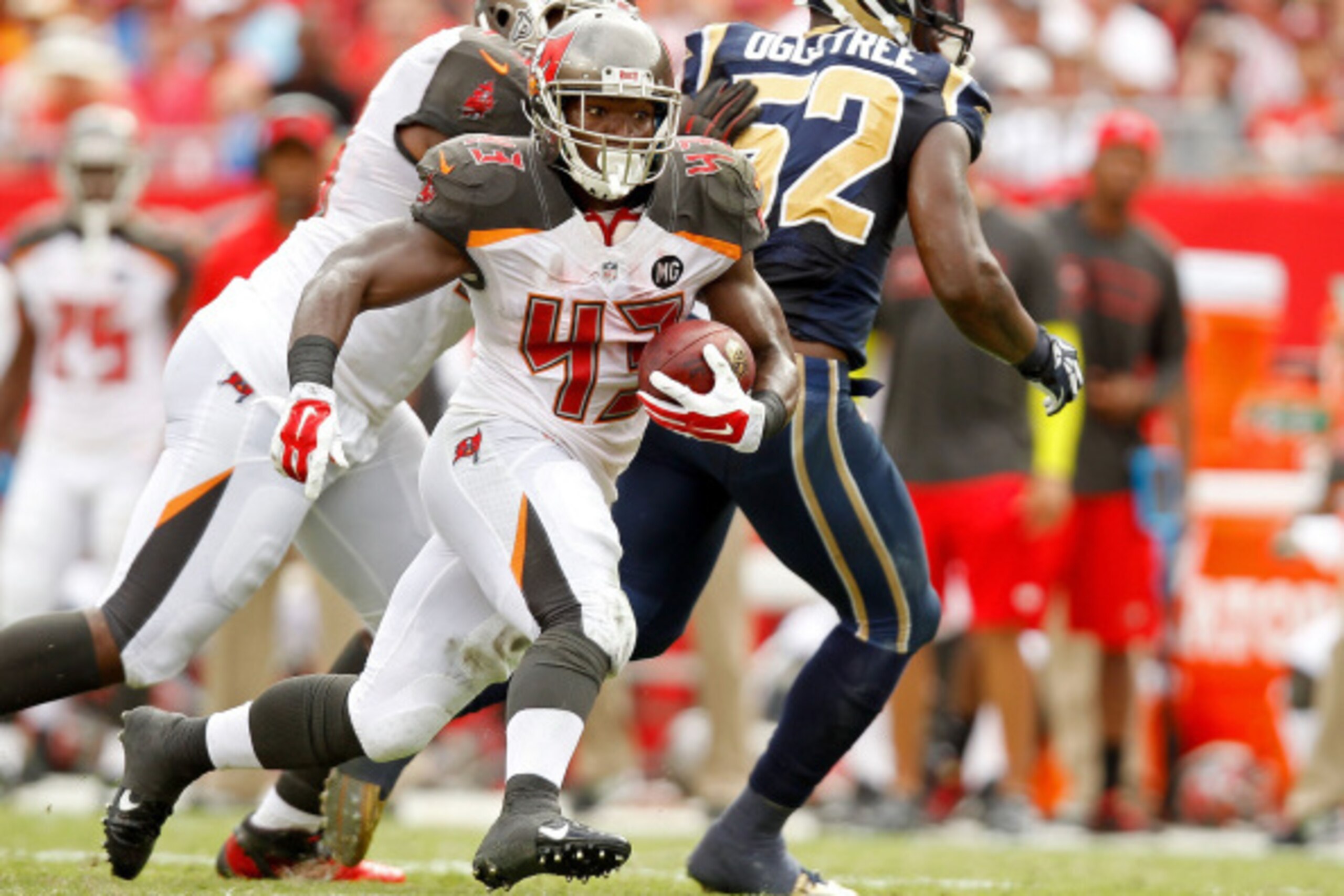 TAMPA, FL - SEPTEMBER 14: Bobby Rainey #43 of the Tampa Bay Buccaneers carries during the first half of the game against the St. Louis Rams at Raymond James Stadium on September 14, 2014 in Tampa, Florida.  (Photo by Scott Iskowitz/Getty Images)