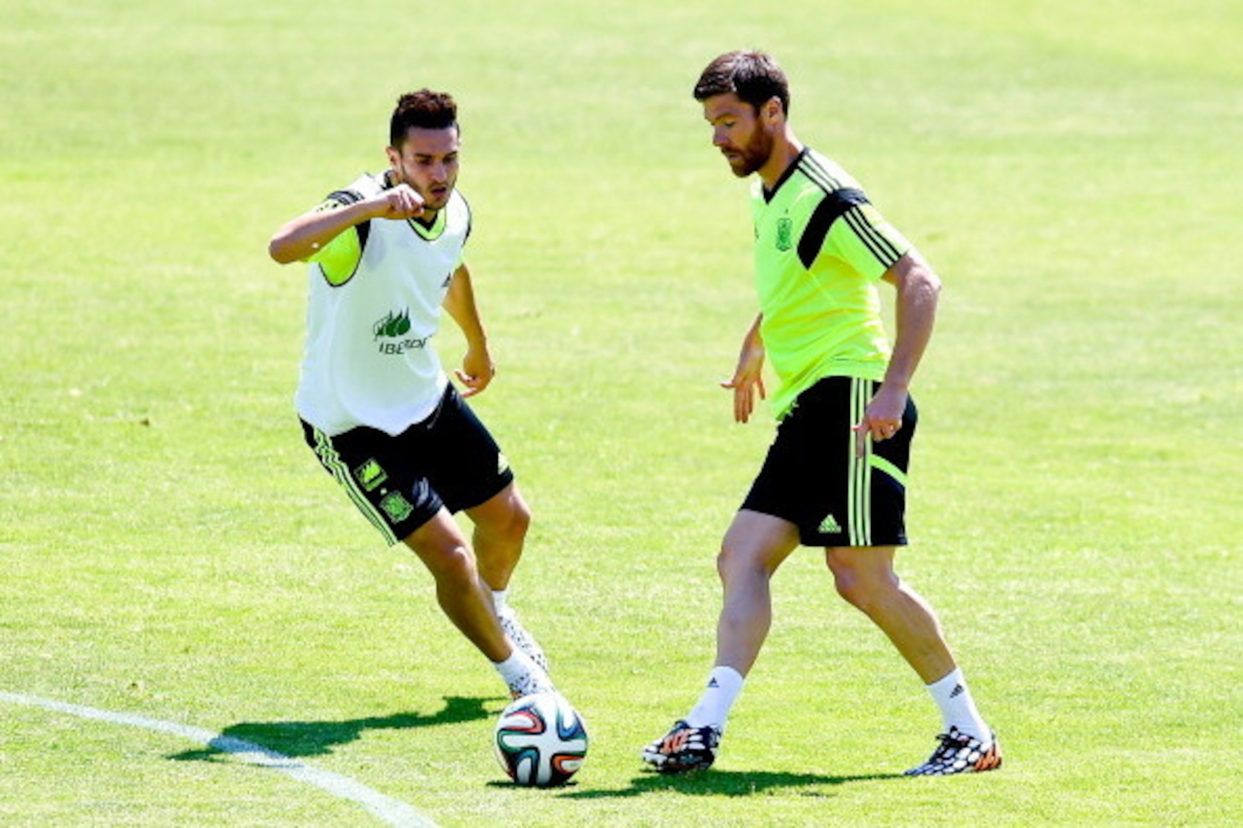 MADRID, SPAIN - JUNE 02:  Koke and Xabi Alonso of Spain in action during a training session at Ciudad del Futbol on June 2, 2014 in Madrid, Spain.  (Photo by David Ramos/Getty Images)
