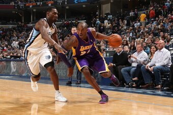MEMPHIS, TN - DECEMBER 17: Kobe Bryant #24 of the Los Angeles Lakers drives to the basket against the Memphis Grizzlies on December 17, 2013 at FedExForum in Memphis, Tennessee. NOTE TO USER: User expressly acknowledges and agrees that, by downloading and