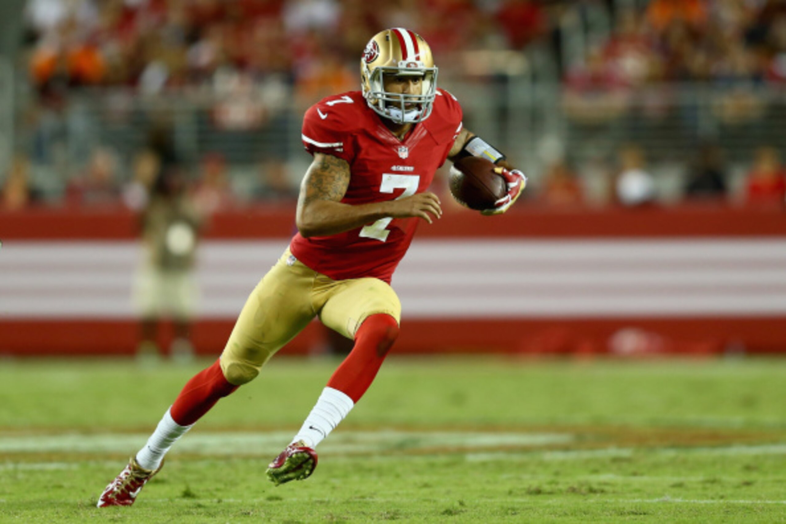 SANTA CLARA, CA - SEPTEMBER 14:  Quarterback Colin Kaepernick #7 of the San Francisco 49ers carries the ball against the Chicago Bears at Levi's Stadium on September 14, 2014 in Santa Clara, California.  (Photo by Jeff Gross/Getty Images)