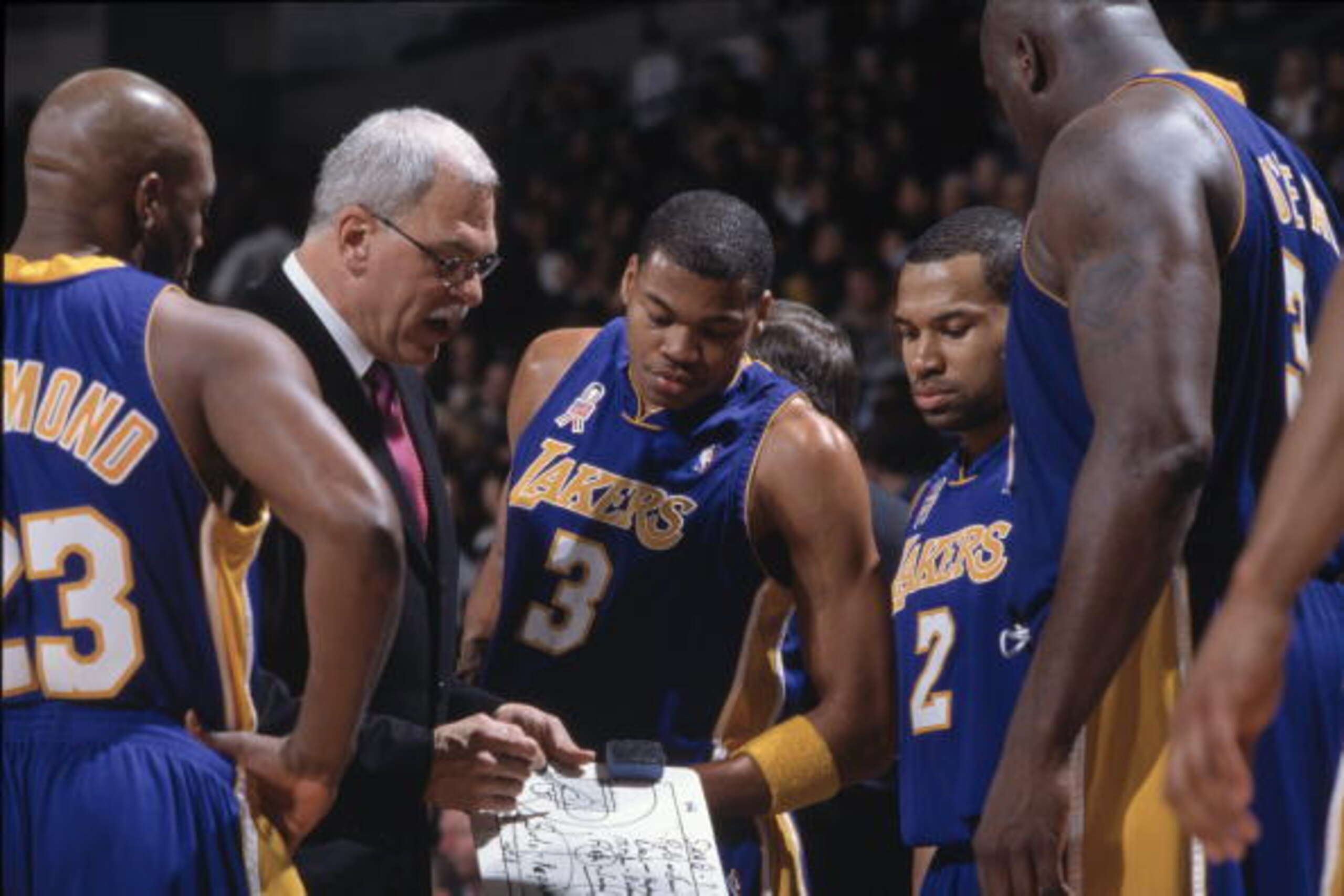 14 Mar 2002:  Head coach Phil Jackson, forward Devean George #3, and several other Los Angeles Lakers huddle during the NBA game against the Golden State Warriors at the Arena in Oakland in Oakland, California. The Lakers defeated the Raptors 110-102.\ NO