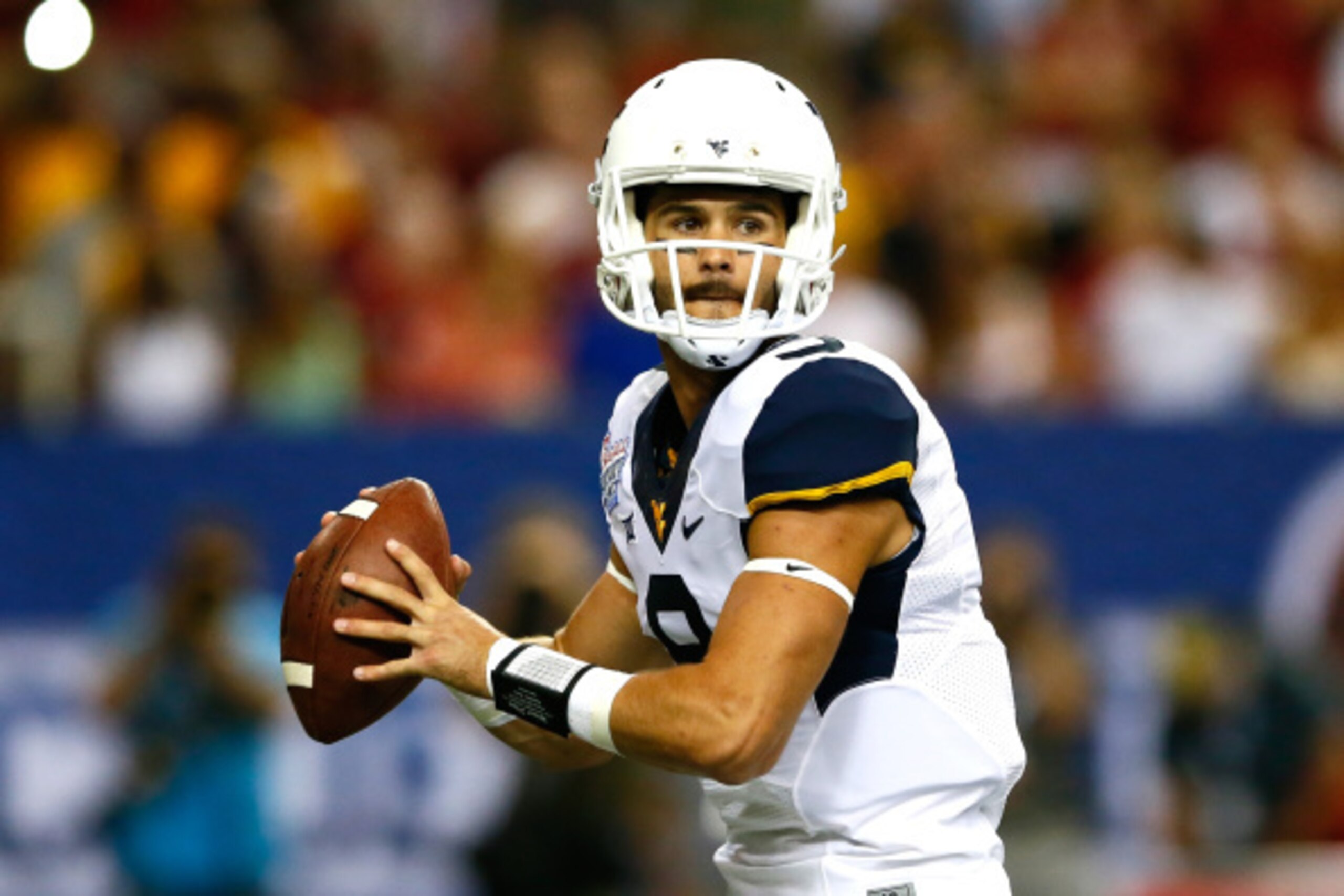 ATLANTA, GA - AUGUST 30: Clint Trickett #9 of the West Virginia Mountaineers looks to pass against the Alabama Crimson Tide at Georgia Dome on August 30, 2014 in Atlanta, Georgia. (Photo by Kevin C. Cox/Getty Images) ATLANTA, GA - AUGUST 30: Clint Trickett #9 of the West Virginia Mountaineers looks to pass against the Alabama Crimson Tide at Georgia Dome on August 30, 2014 in Atlanta, Georgia. (Photo by Kevin C. Cox/Getty Images)