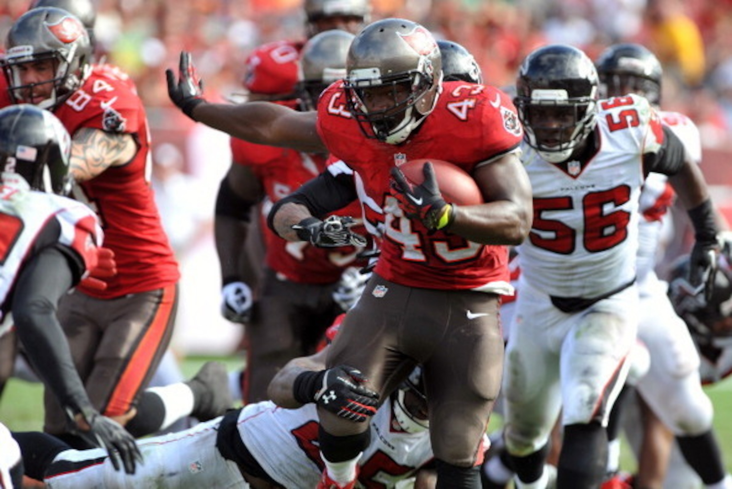 TAMPA, FL -  NOVEMBER 17:  Running back Bobby Rainey #43 of the Tampa Bay Buccaneers rushes upfield against the Atlanta Falcons  November 17, 2013 at Raymond James Stadium in Tampa, Florida. (Photo by Al Messerschmidt/Getty Images)