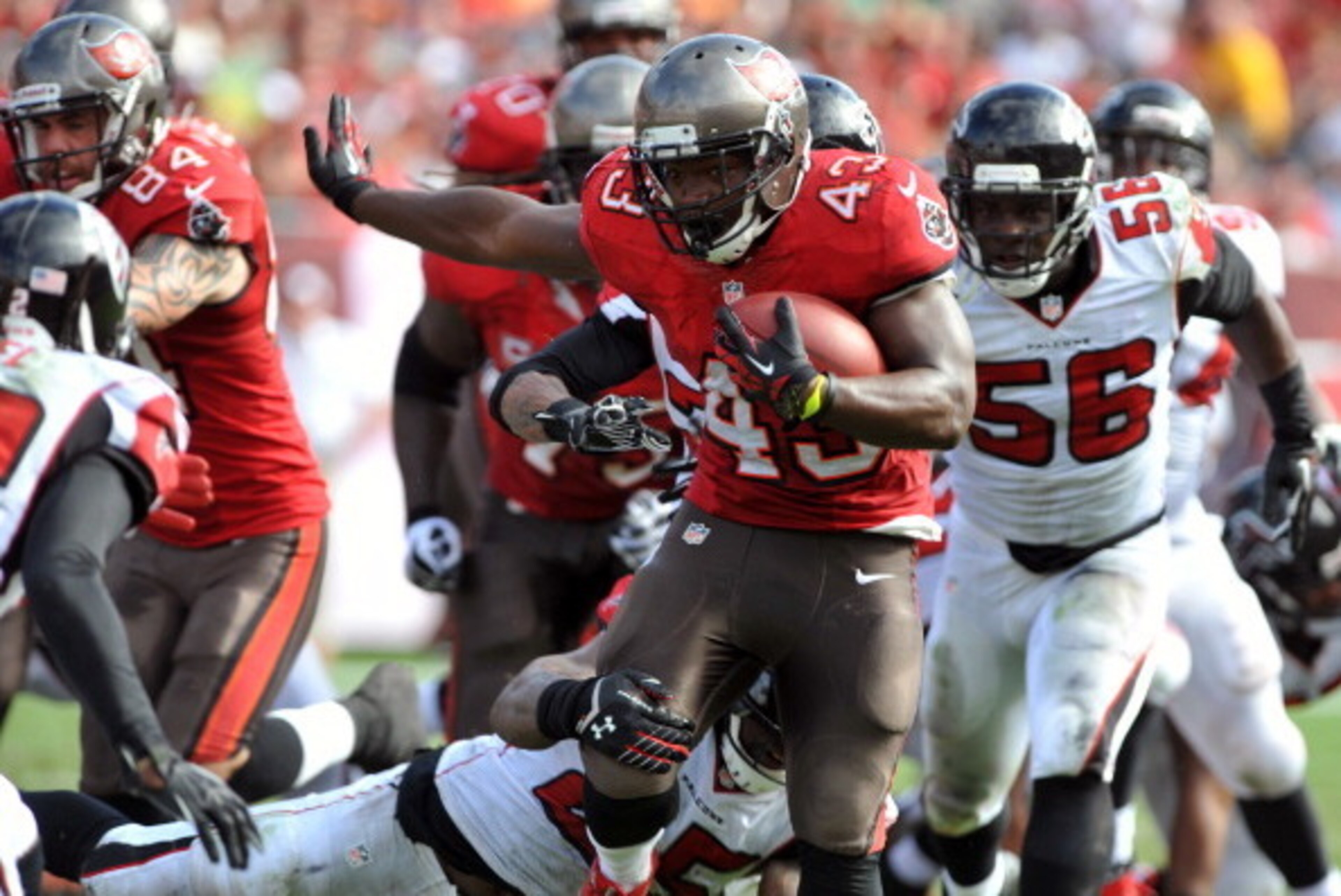 TAMPA, FL -  NOVEMBER 17:  Running back Bobby Rainey #43 of the Tampa Bay Buccaneers rushes upfield against the Atlanta Falcons  November 17, 2013 at Raymond James Stadium in Tampa, Florida. (Photo by Al Messerschmidt/Getty Images)