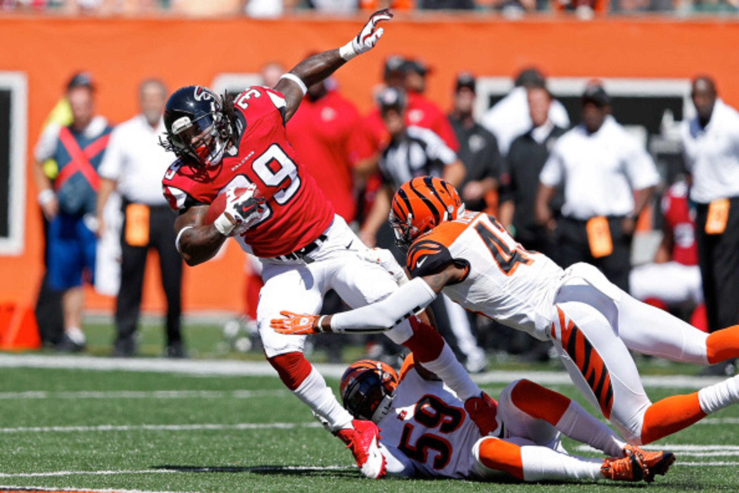 CINCINNATI, OH - SEPTEMBER 14:  George Iloka #43 of the Cincinnati Bengals and Emmanuel Lamur #59 of the Cincinnati Bengals combine to tackle Steven Jackson #39 of the Atlanta Falcons during the second quarter at Paul Brown Stadium on September 14, 2014 i