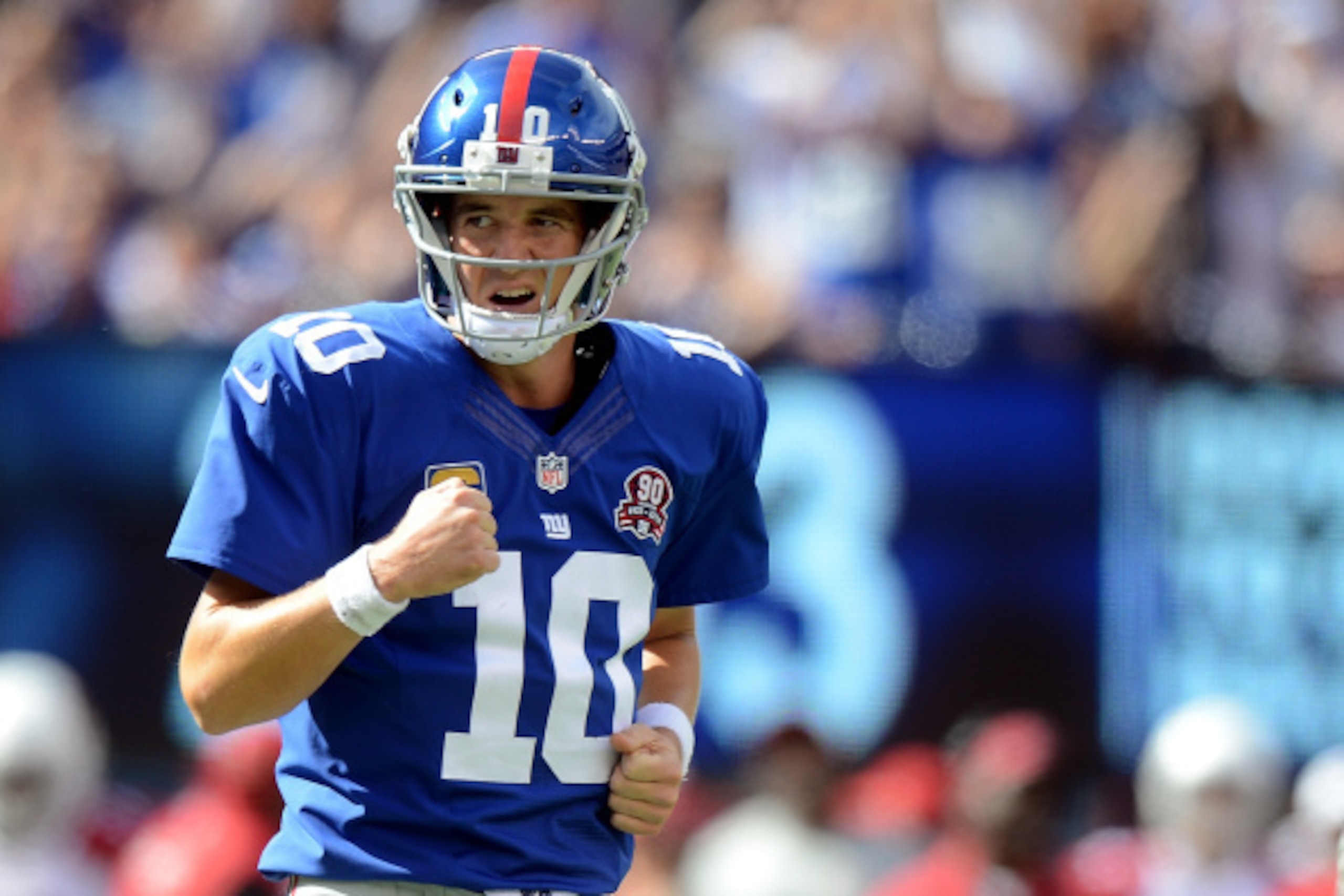 EAST RUTHERFORD, NJ - SEPTEMBER 14:  Quarterback Eli Manning #10 of the New York Giants celebrates a third quarter touchdown against the Arizona Cardinals during a game at MetLife Stadium on September 14, 2014 in East Rutherford, New Jersey.  (Photo by Ro