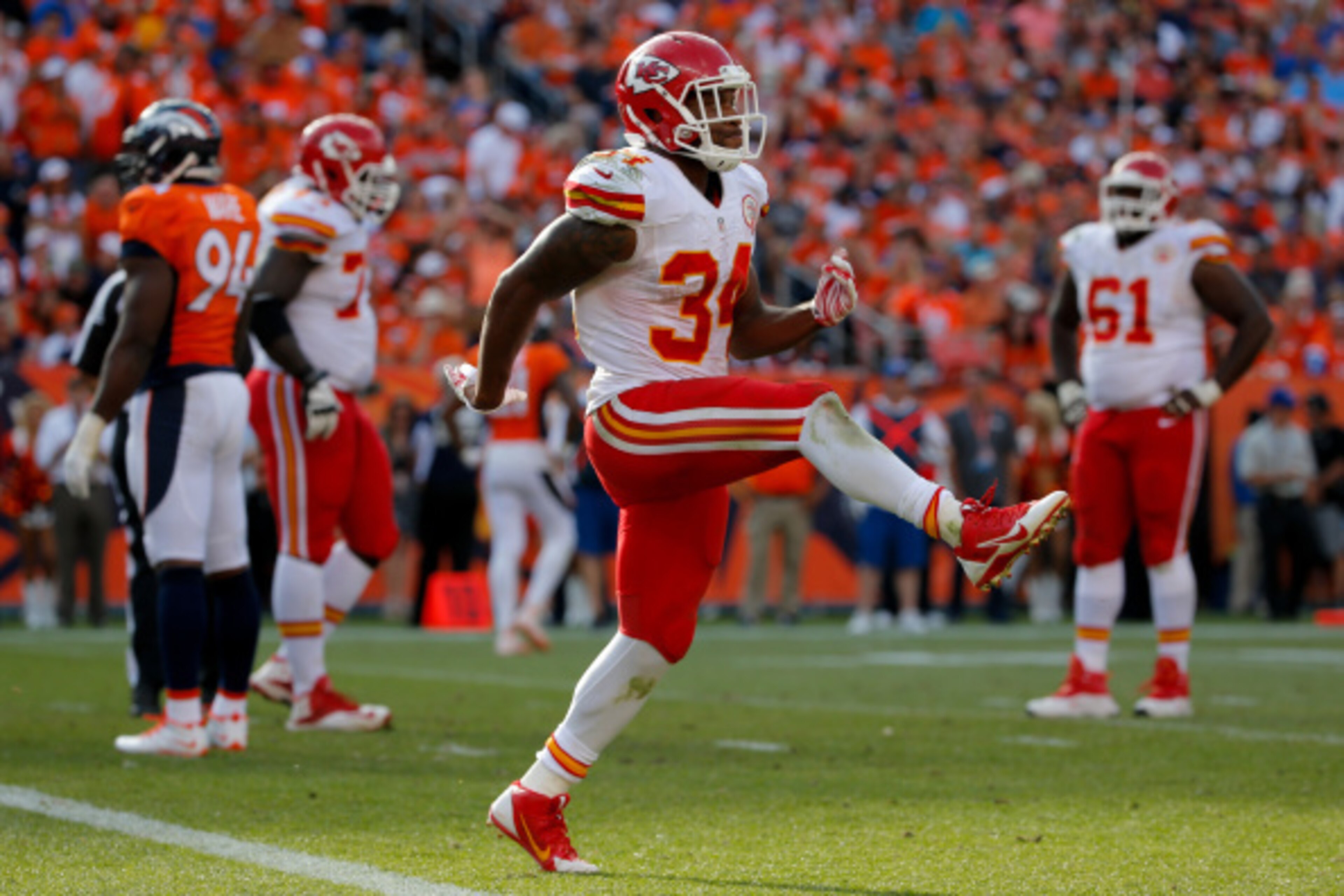 DENVER, CO - SEPTEMBER 14: Running back Knile Davis #34 of the Kansas City Chiefs celebrates a fourth quarter touchdown against the Denver Broncos during a game at Sports Authority Field at Mile High on September 14, 2014 in Denver, Colorado. (Photo by DENVER, CO - SEPTEMBER 14: Running back Knile Davis #34 of the Kansas City Chiefs celebrates a fourth quarter touchdown against the Denver Broncos during a game at Sports Authority Field at Mile High on September 14, 2014 in Denver, Colorado. (Photo by