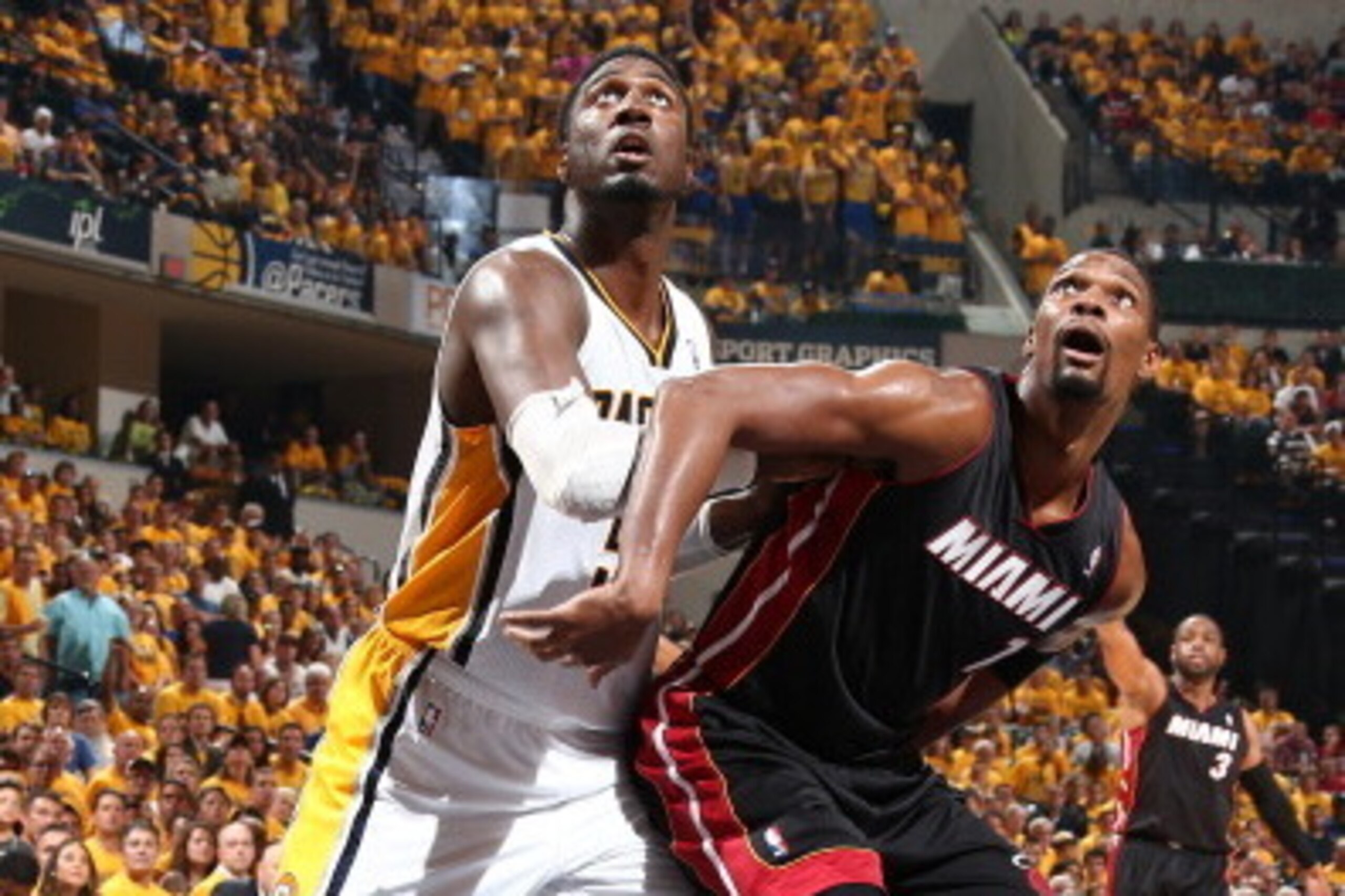INDIANAPOLIS, IN - MAY 28: Roy Hibbert #55 of the Indiana Pacers fights for position against Chris Bosh #1 of the Miami Heat in Game Five of the Eastern Conference Finals during the 2014 NBA Playoffs on May 28, 2014 at Bankers Life Fieldhouse, Indianapoli