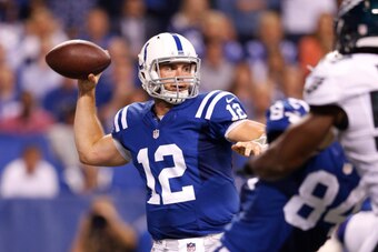 INDIANAPOLIS, IN - SEPTEMBER 15: Andrew Luck #12 of the Indianapolis Colts passes the ball in the first half of the game against the Philadelphia Eagles at Lucas Oil Stadium on September 15, 2014 in Indianapolis, Indiana. (Photo by Joe Robbins/Getty Image