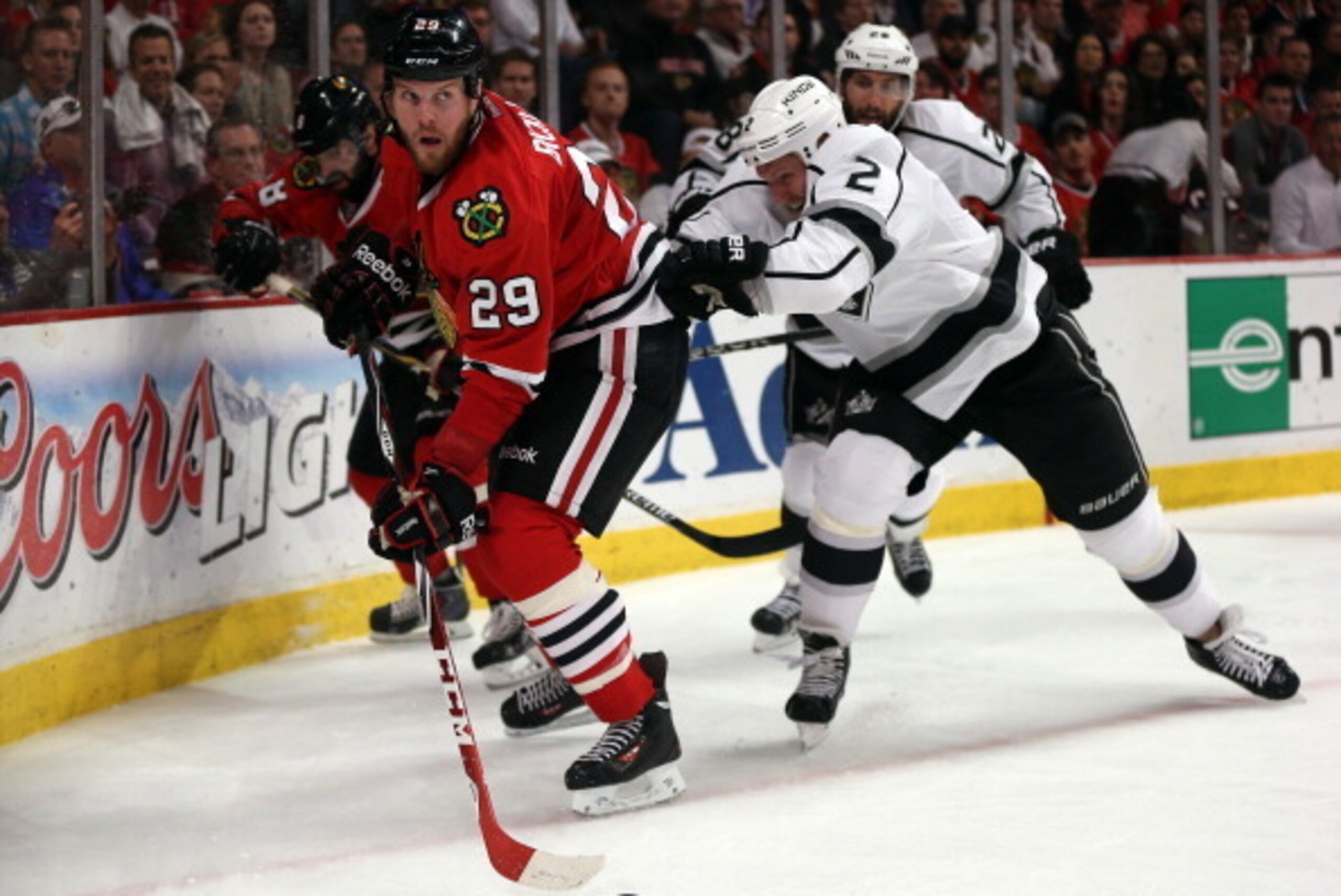 CHICAGO, IL - MAY 28:  Matt Greene #2 of the Los Angeles Kings checks Bryan Bickell #29 of the Chicago Blackhawks during Game Five of the Western Conference Final in the 2014 Stanley Cup Playoffs at United Center on May 28, 2014 in Chicago, Illinois.  (Ph
