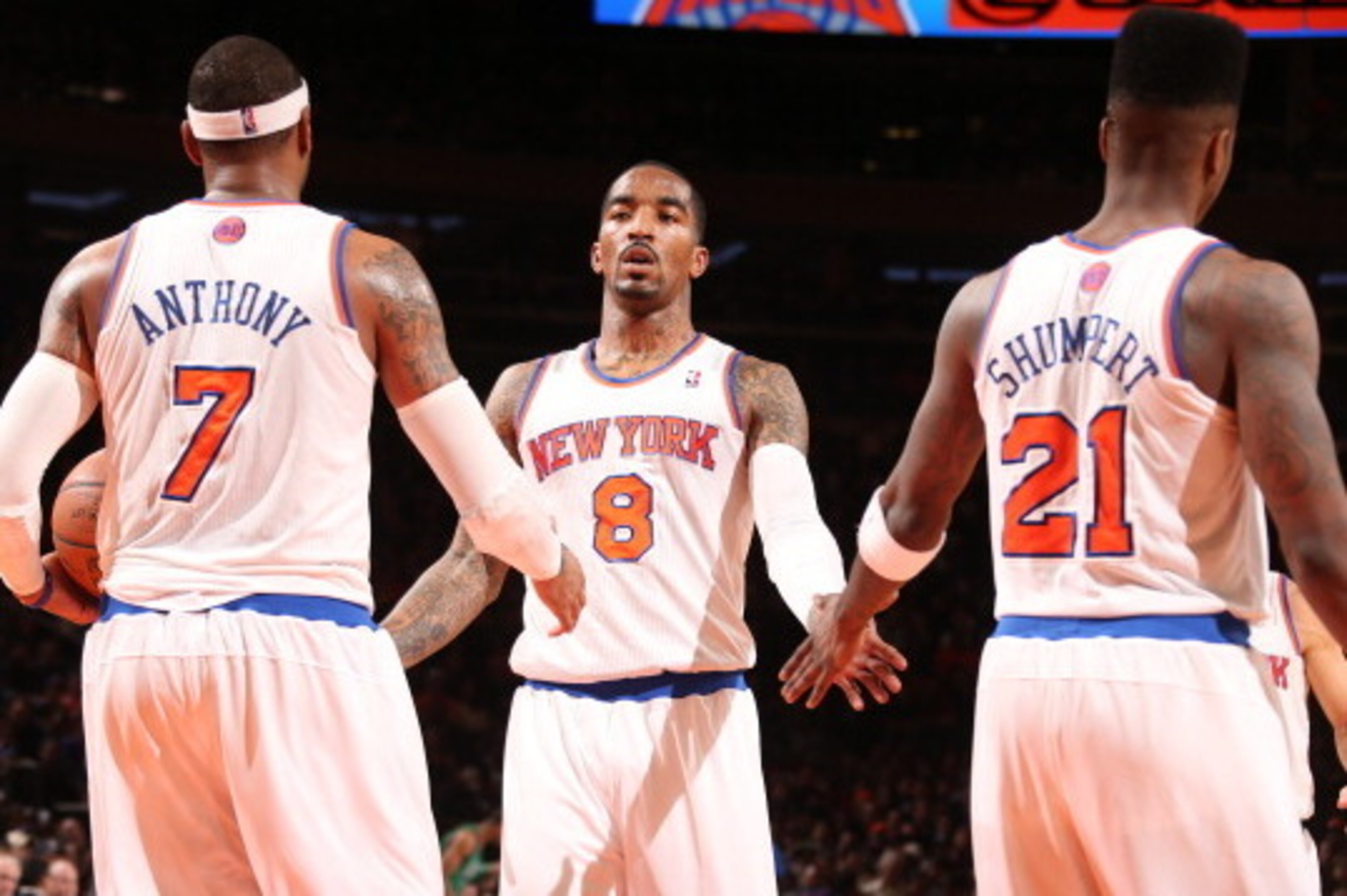 NEW YORK, NY - MARCH 31: J.R. Smith #8 of the New York Knicks high-fives teammates Carmelo Anthony #7 and Iman Shumpert #21 in a game against the Boston Celtics on March 31, 2013 at Madison Square Garden in New York City.  NOTE TO USER: User expressly ack