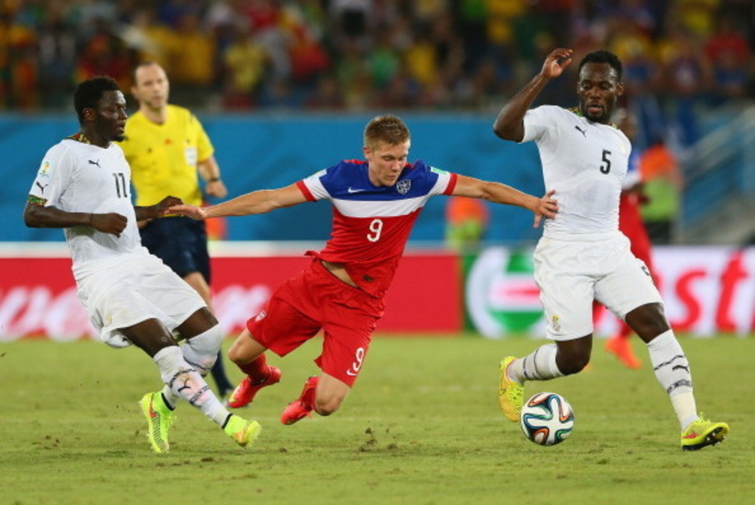 NATAL, BRAZIL - JUNE 16: Aron Johannsson of the United States is challenged by Sulley Muntari (L) and Michael Essien of Ghana during the 2014 FIFA World Cup Brazil Group G match between Ghana and the United States at Estadio das Dunas on June 16, 2014 in NATAL, BRAZIL - JUNE 16: Aron Johannsson of the United States is challenged by Sulley Muntari (L) and Michael Essien of Ghana during the 2014 FIFA World Cup Brazil Group G match between Ghana and the United States at Estadio das Dunas on June 16, 2014 in