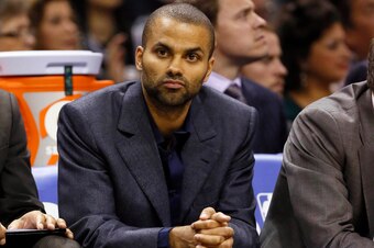 Mar 14, 2013; San Antonio, TX, USA; San Antonio Spurs guard Tony Parker (9) watches from the bench during the second half against the Dallas Mavericks at the AT&T Center. The Spurs won 92-91. Mandatory Credit: Soobum Im-USA TODAY Sports