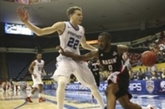 Mar 16, 2014; New Orleans, LA, USA; Louisiana Lafayette Ragin Cajuns guard Bryant Mbamalu (0) drives the ball toward the basket as he is defended by Georgia State Panthers guard R.J. Hunter (22) in the first half of the championship game of the Sun Belt C