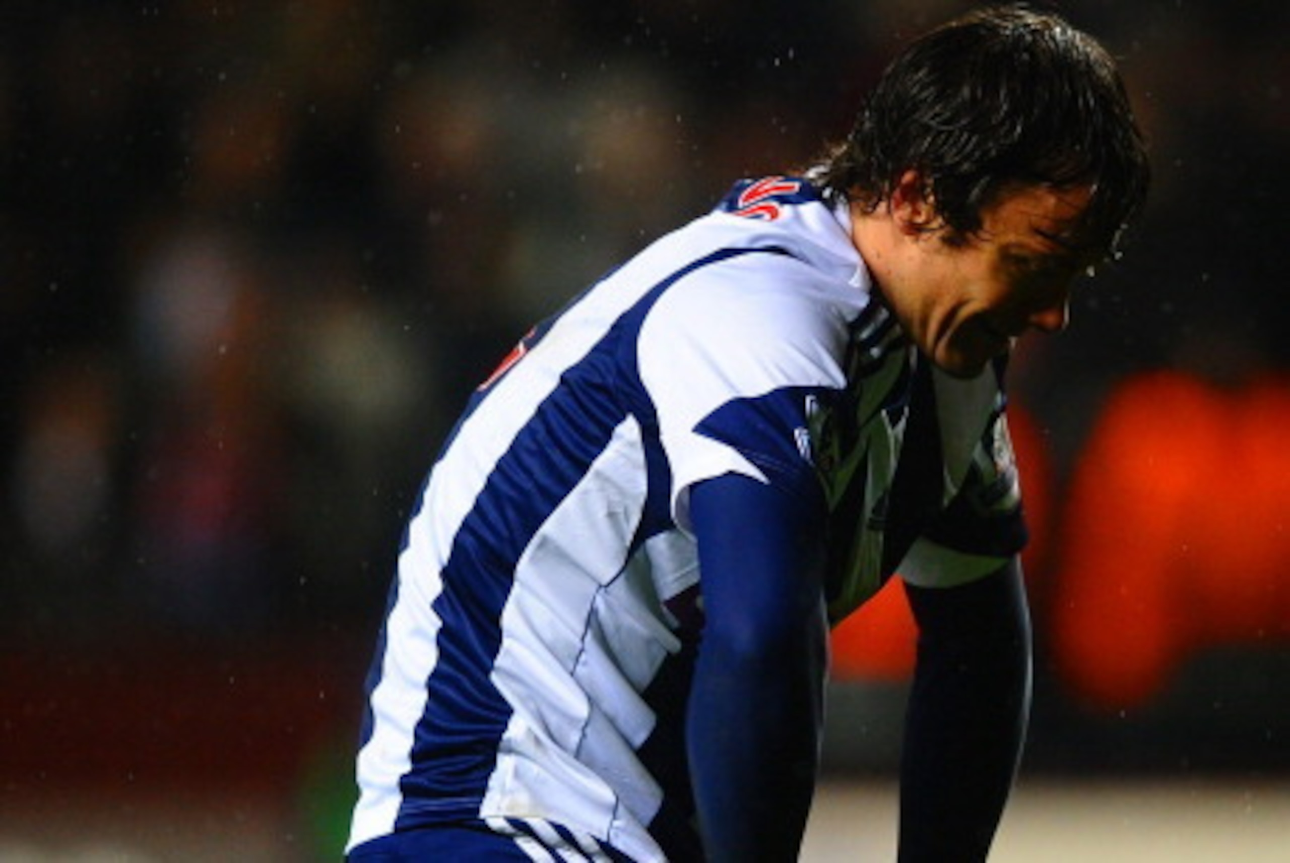 BIRMINGHAM, ENGLAND - JANUARY 29: A dejected Diego Lugano of West Brom looks to the ground after conceding a penalty during the Barclays Premier League match between Aston Villa and West Bromwich Albion at Villa Park on January 29, 2014 in Birmingham, Eng