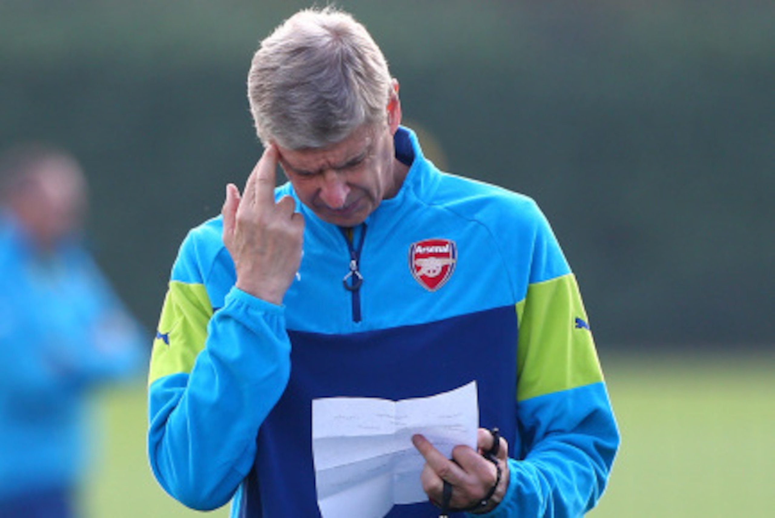 ST ALBANS, ENGLAND - SEPTEMBER 15: Arsenal manager Arsene Wenger ponders during a Arsenal Training Session ahead of their Champions League fixture against Borussia Dortmund on September 15, 2014 in St Albans, England. (Photo by Charlie Crowhurst/Getty Ima