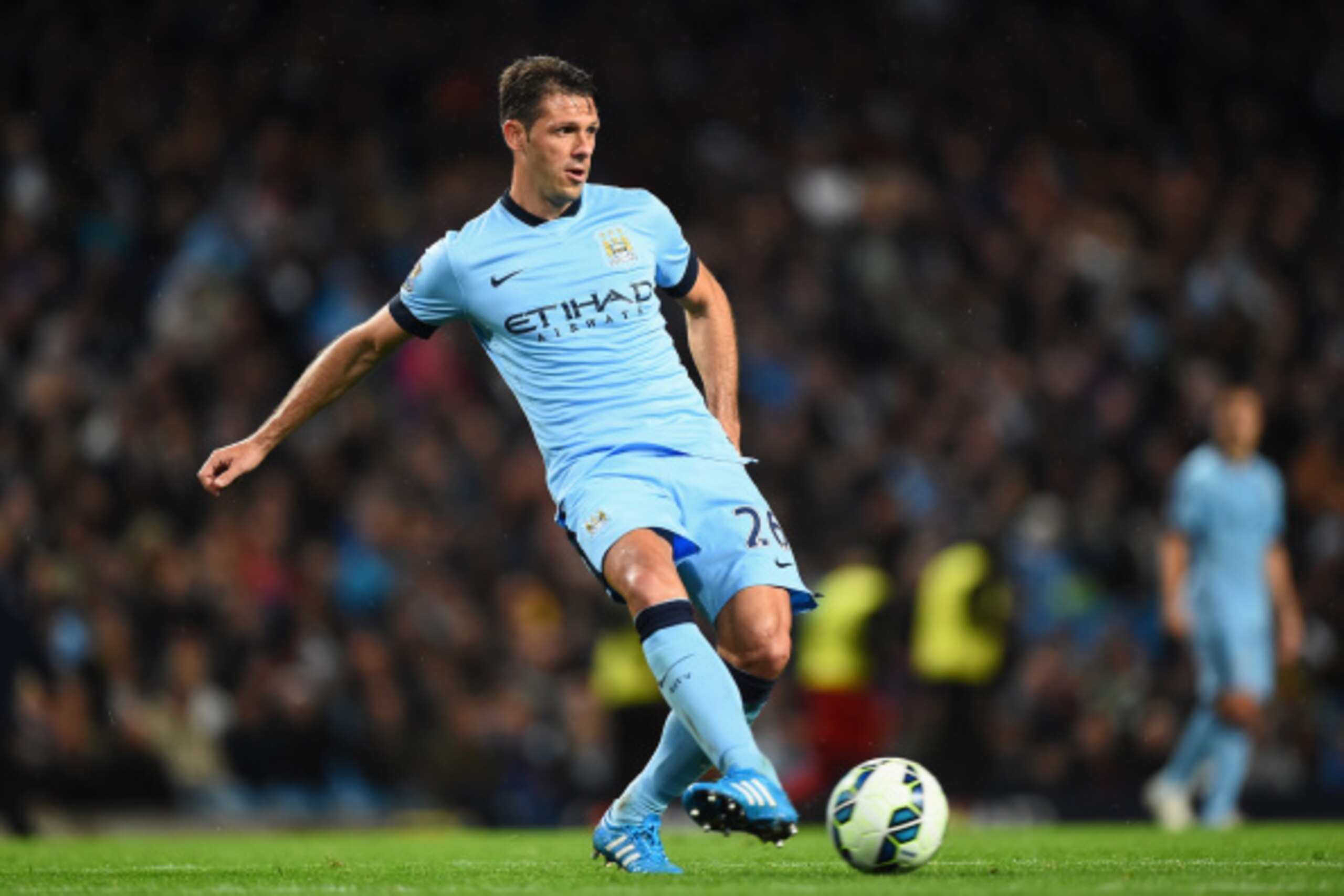 MANCHESTER, ENGLAND - AUGUST 25:  Martin Demichelis of Manchester City in action during the Barclays Premier League match between Manchester City and Liverpool at the Etihad Stadium on August 25, 2014 in Manchester, England.  (Photo by Laurence Griffiths/