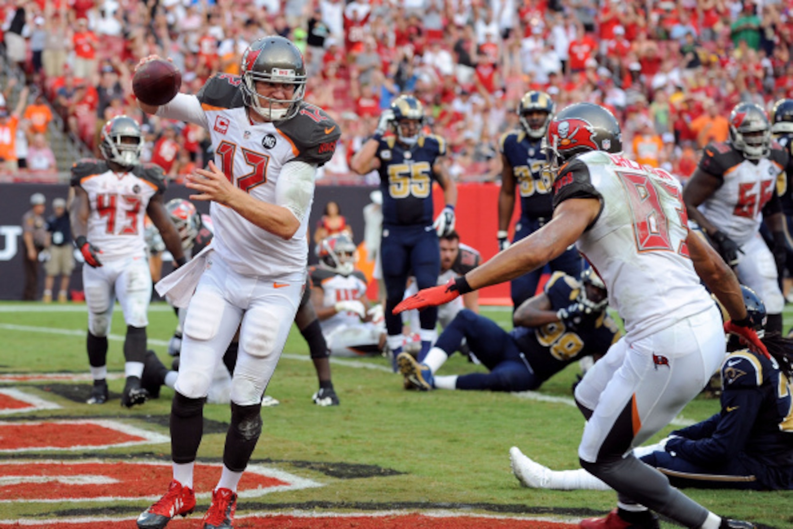 TAMPA, FL - SEPTEMBER 14:  Josh McCown #12 of the Tampa Bay Buccaneers celebrates with Vincent Jackson #83 after scoring a touchdown during the second half of the game against the St. Louis Rams at Raymond James Stadium on September 14, 2014 in Tampa, Flo