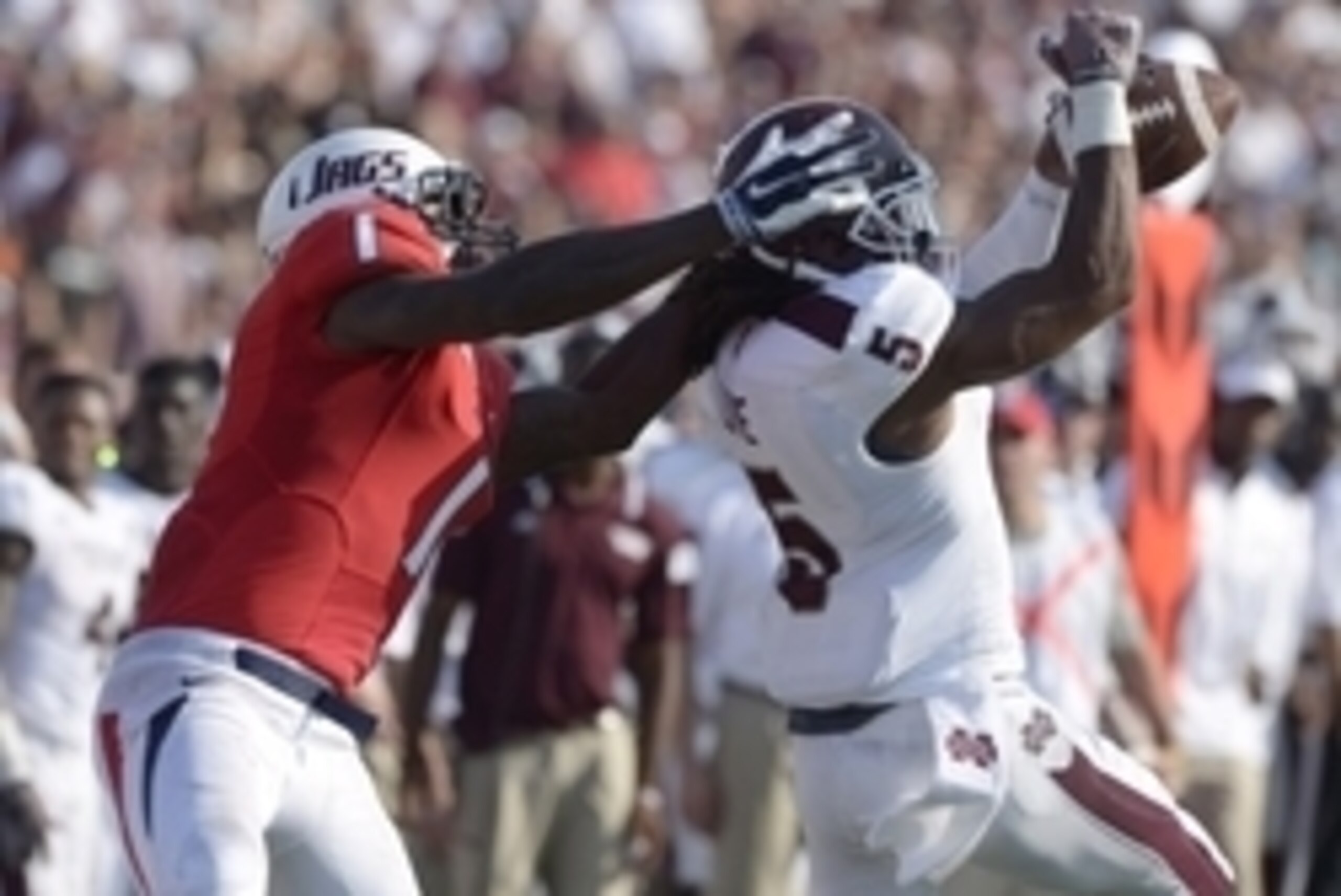 Sep 13, 2014; Mobile, AL, USA; Mississippi State Bulldogs defensive back Jamerson Love (5) breaks up a pass intended for South Alabama Jaguars wide receiver Shavarez Smith (1) in the third quarter at Ladd-Peebles Stadium. Mississippi State defeated South 