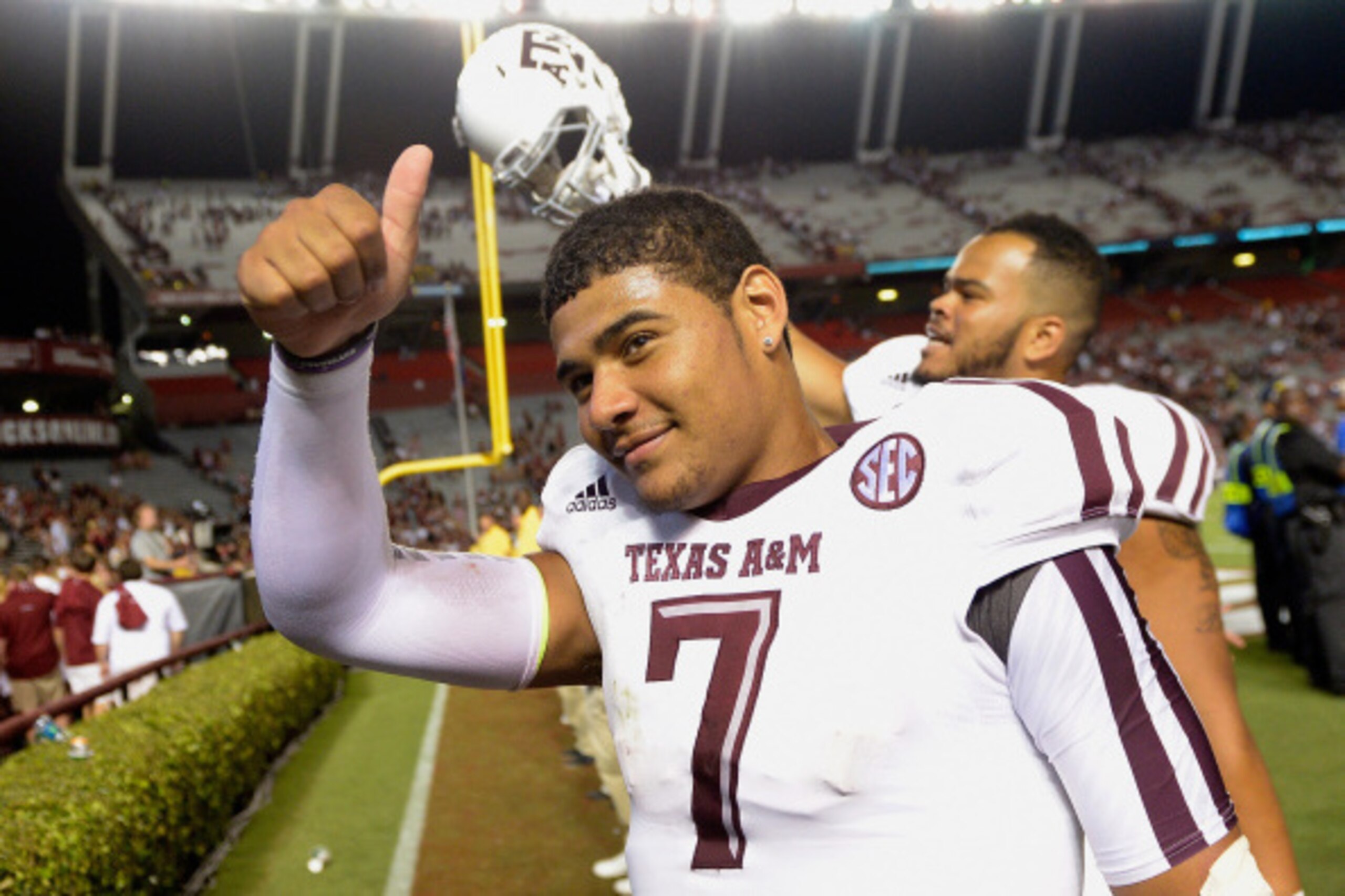 COLUMBIA, SC - AUGUST 28:  Kenny Hill #7 of the Texas A&M Aggies flashes a thumbs-up as he leave the field afte a win over the South Carolina Gamecocks at Williams-Brice Stadium on August 28, 2014 in Columbia, South Carolina. Texas A&M won 52-28.  (Photo 