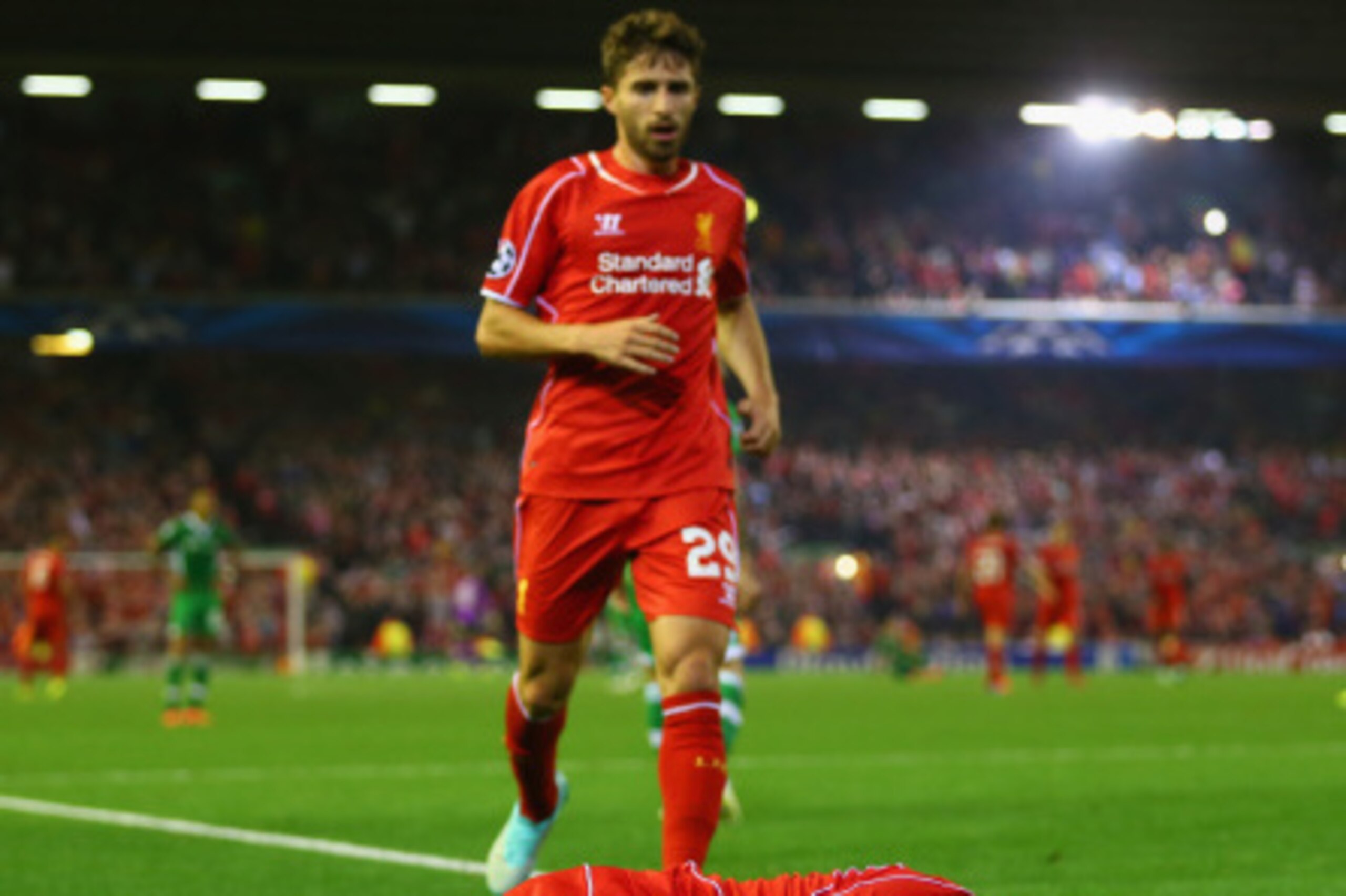 LIVERPOOL, ENGLAND - SEPTEMBER 16:  Fabio Borini of Liverpool tends to Javi Manquillo of Liverpool after he was brought down for a penalty during the UEFA Champions League Group B match between Liverpool FC and PFC Ludogorets Razgrad at Anfield on Septemb
