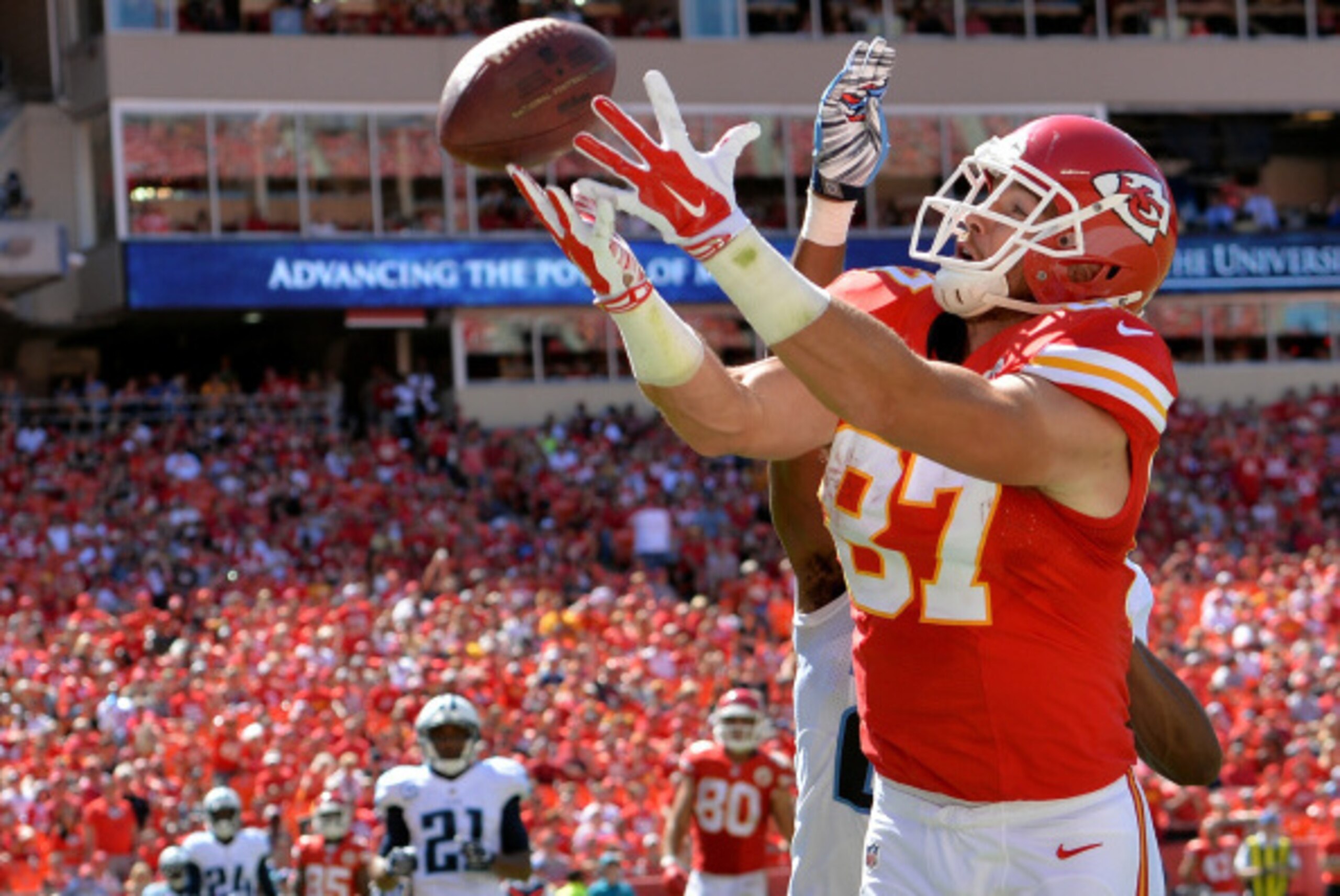 KANSAS CITY, MO - SEPTEMBER 07: Travis Kelce #87 of the Kansas City Chiefs reaches out for the ball in the endzone as Blidi Wreh-Wilson #25 of the Tennessee Titans defends during the second half as at Arrowhead Stadium on September 7, 2014 in Kansas Ci KANSAS CITY, MO - SEPTEMBER 07: Travis Kelce #87 of the Kansas City Chiefs reaches out for the ball in the endzone as Blidi Wreh-Wilson #25 of the Tennessee Titans defends during the second half as at Arrowhead Stadium on September 7, 2014 in Kansas Ci