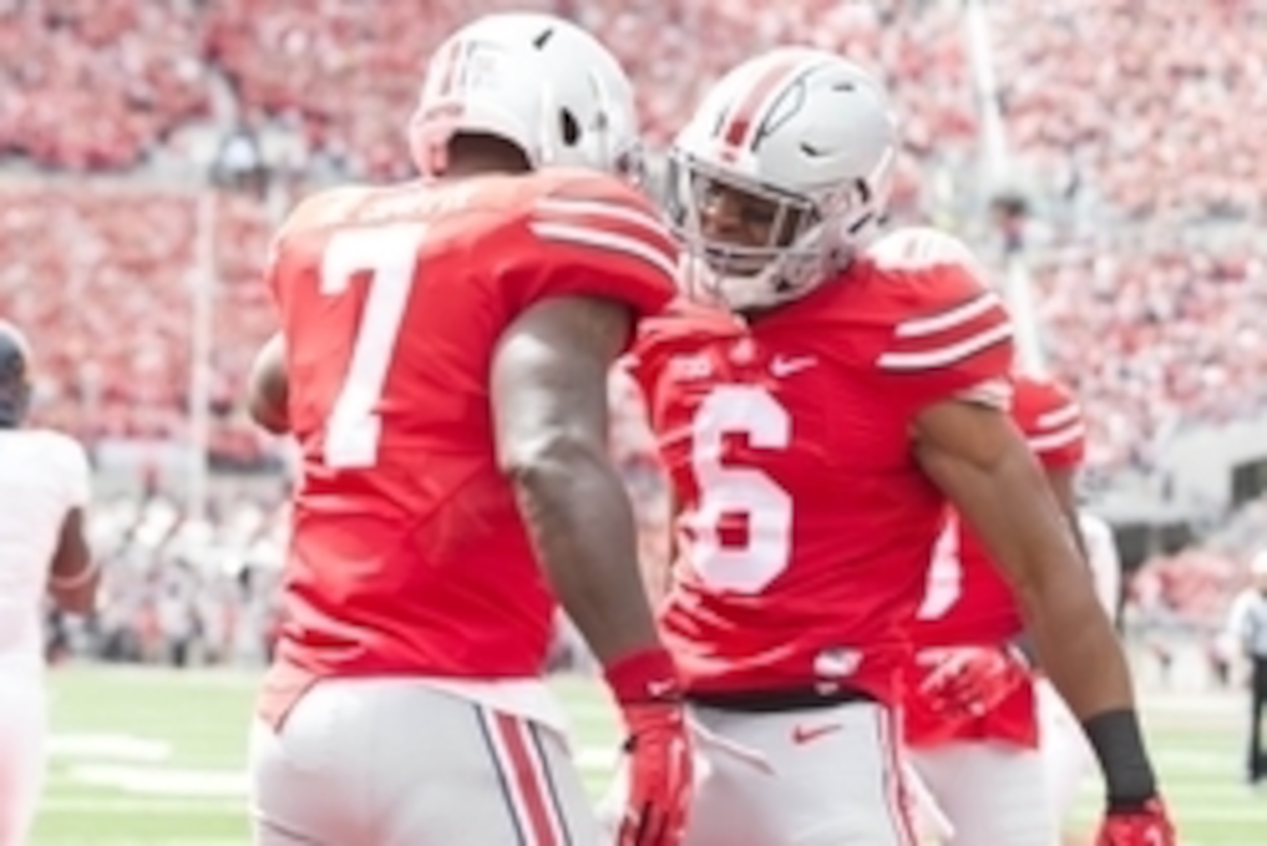 Sep 13, 2014; Columbus, OH, USA; Ohio State Buckeyes running back Rod Smith (7) and wide receiver Evan Spencer (6) celebrate Smith's touchdown against the Kent State Golden Flashes at Ohio Stadium. Mandatory Credit: Greg Bartram-USA TODAY Sports