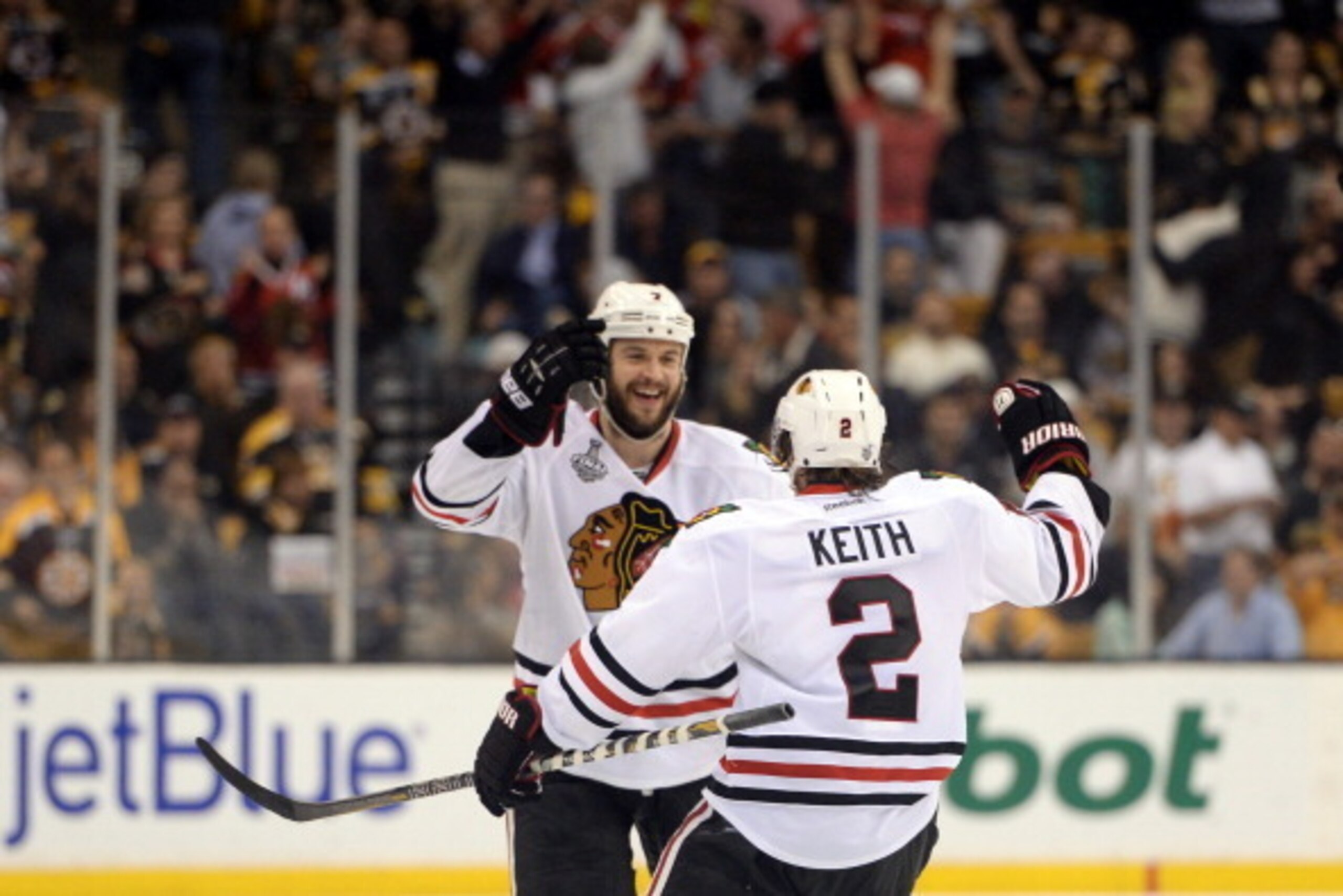 BOSTON, MA - JUNE 19:  Brent Seabrook #7 of the Chicago Blackhawks celebrates with Duncan Keith #2 after scoring the game winning goal against the Boston Bruins in overtime in Game Four of the 2013 NHL Stanley Cup Final at TD Garden on June 19, 2013 in Bo