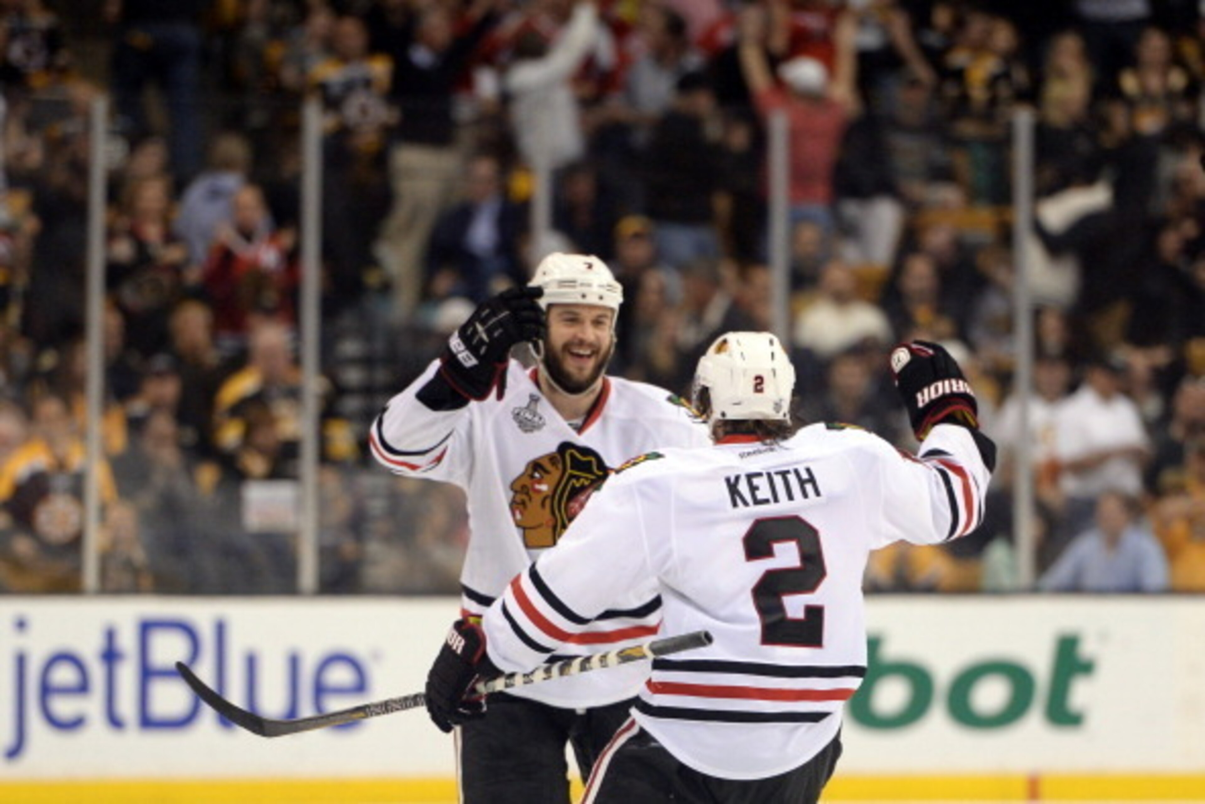 BOSTON, MA - JUNE 19:  Brent Seabrook #7 of the Chicago Blackhawks celebrates with Duncan Keith #2 after scoring the game winning goal against the Boston Bruins in overtime in Game Four of the 2013 NHL Stanley Cup Final at TD Garden on June 19, 2013 in Bo