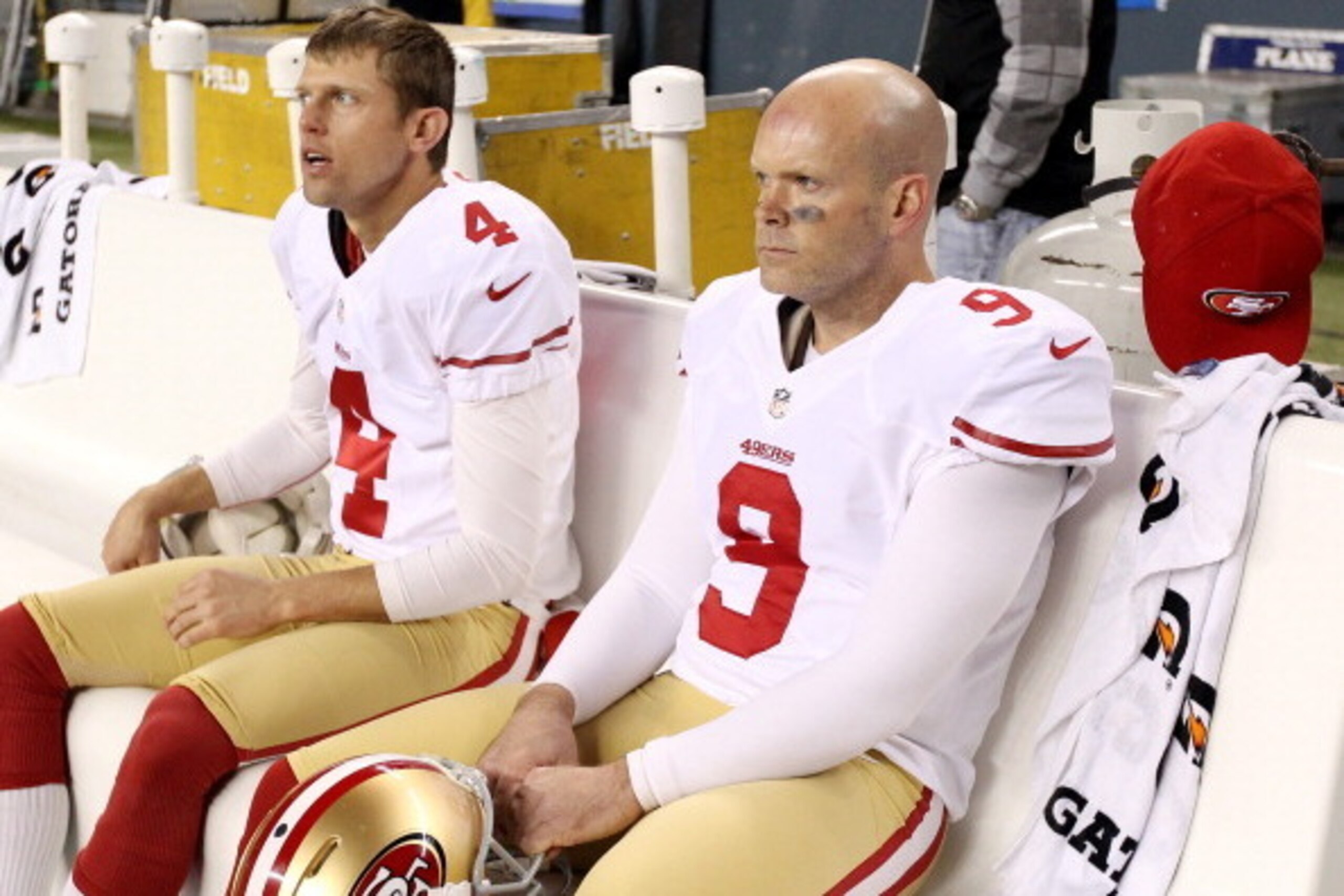 SEATTLE, WA - JANUARY 19: Kicker Phil Dawson #9 and punter Andy Lee #4 of the San Francisco 49ers sit on the bench during the 2014 NFC Championship against the Seattle Seahawks at CenturyLink Field on January 19, 2014 in Seattle, Washington.  (Photo by Ch