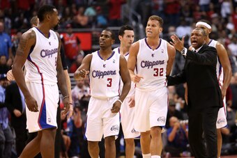 LOS ANGELES, CA - OCTOBER 31:  DeAndre Jordan #6 (L) of the Los Angeles Clippers is intercetped by Chris Paul #3, Blake Griffin #32, and head coach Doc Rivers after Jordan got in an altercation with Andrew Bogut #12 of the Golden State Warriors at Staples