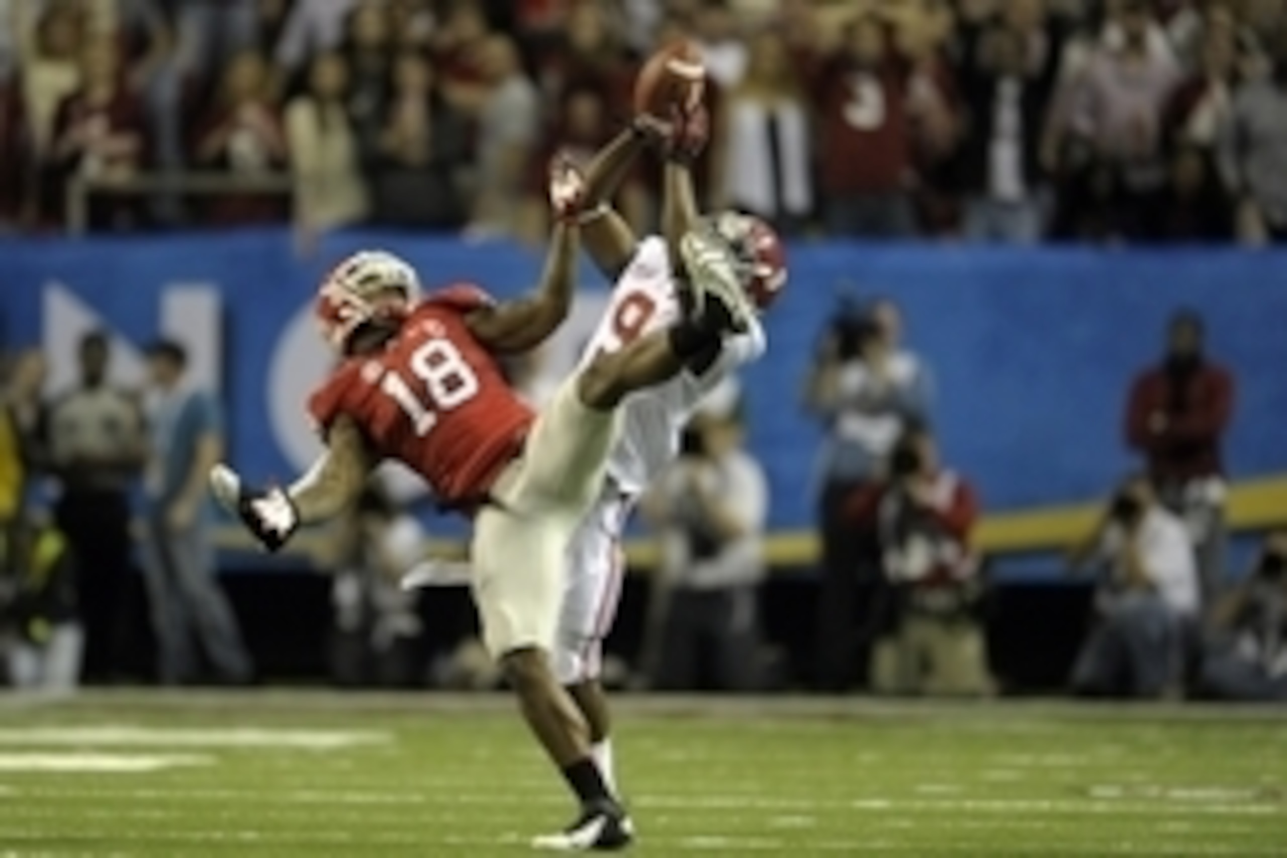 Dec 1, 2012; Atlanta, GA, USA; Alabama Crimson Tide wide receiver Amari Cooper (9) catches a pass against Georgia Bulldogs safety Bacarri Rambo (18) during the second quarter of the 2012 SEC Championship game at the Georgia Dome.  Mandatory Credit: Paul A