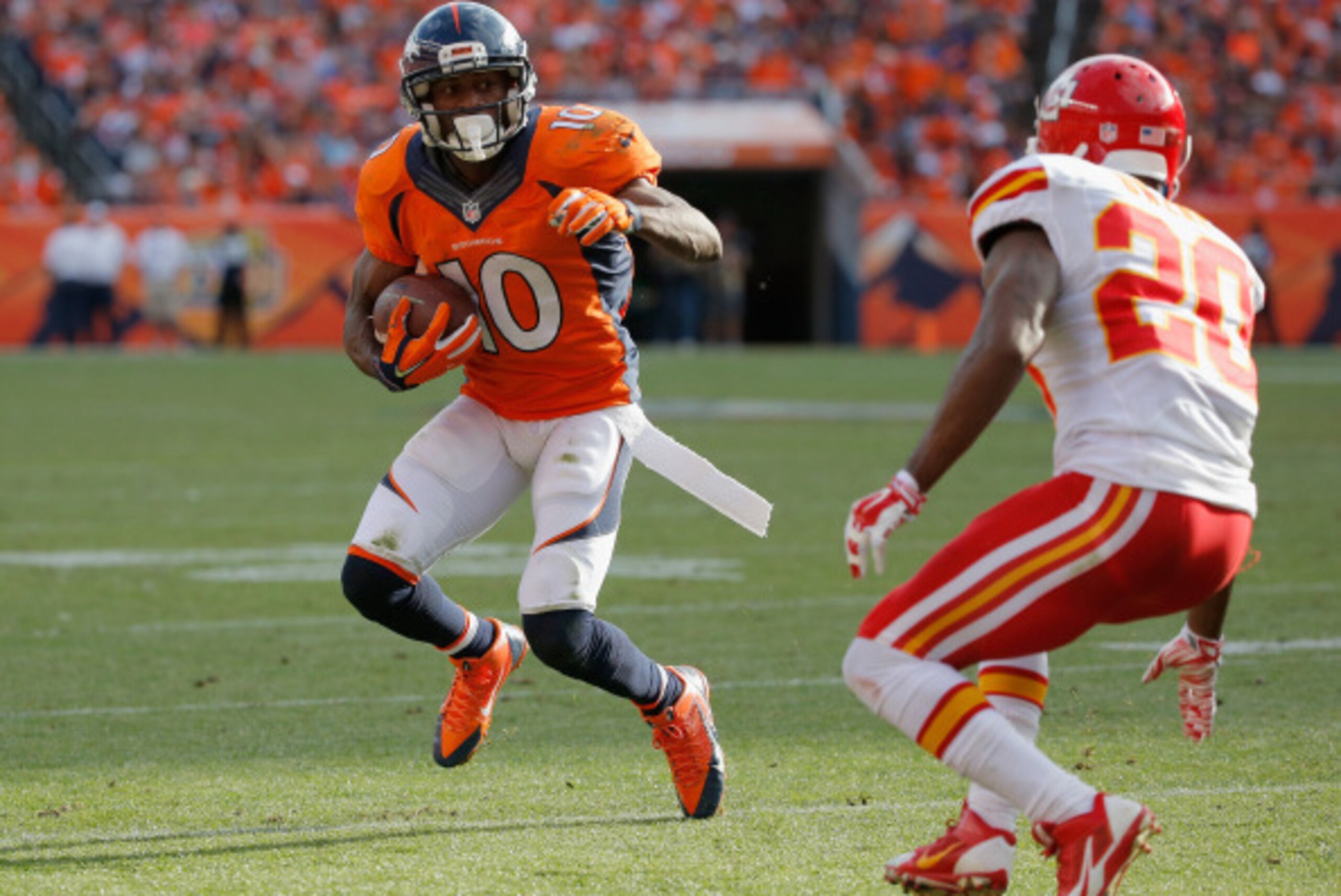 DENVER, CO - SEPTEMBER 14:  Wide receiver Emmanuel Sanders #10 of the Denver Broncos makes a reception against cornerback Chris Owens #20 of the Kansas City Chiefs at Sports Authority Field at Mile High on September 14, 2014 in Denver, Colorado. The Bronc