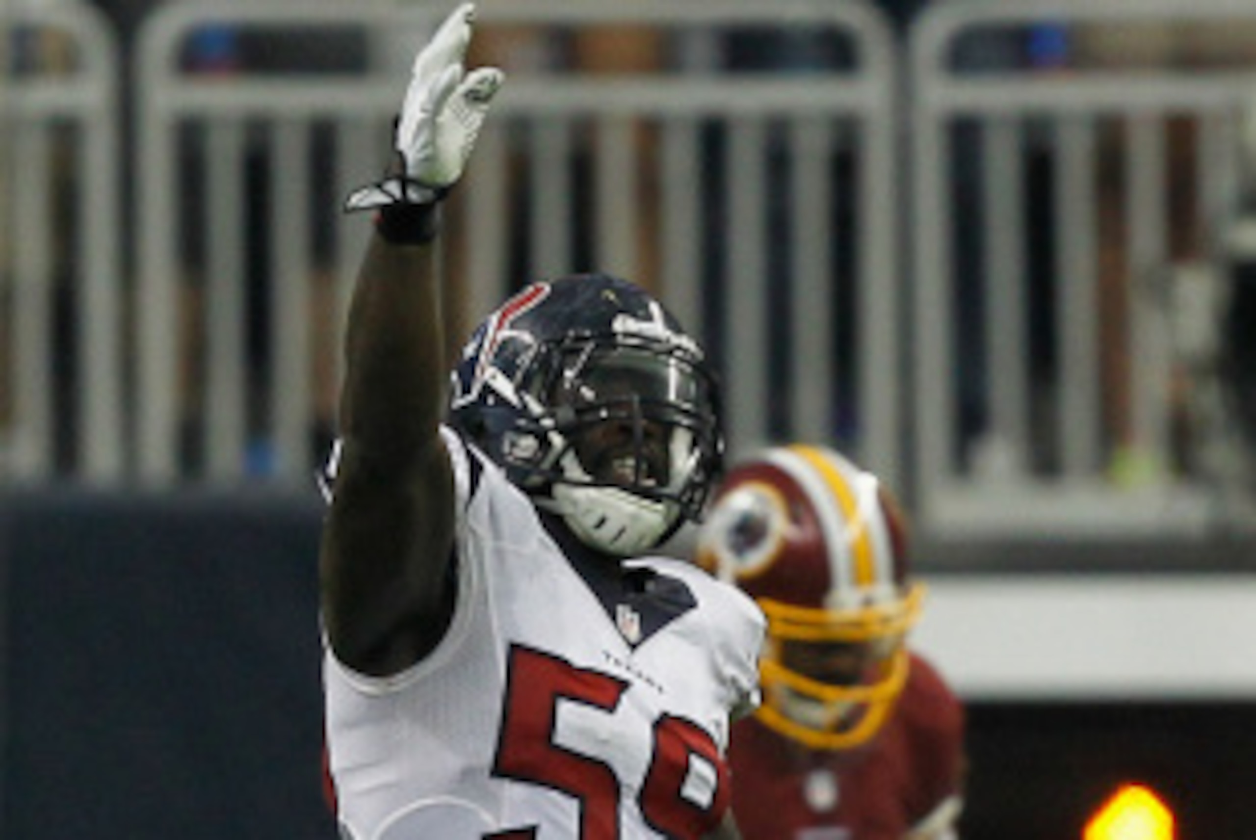 HOUSTON, TX - SEPTEMBER 07: Whitney Mercilus #59 of the Houston Texans celebrates after the Houston Texans recovered a fumble in the third quarter against the Washington Redskins at Reliant Stadium on September 7, 2014 in Houston, Texas.  (Photo by Bob Le