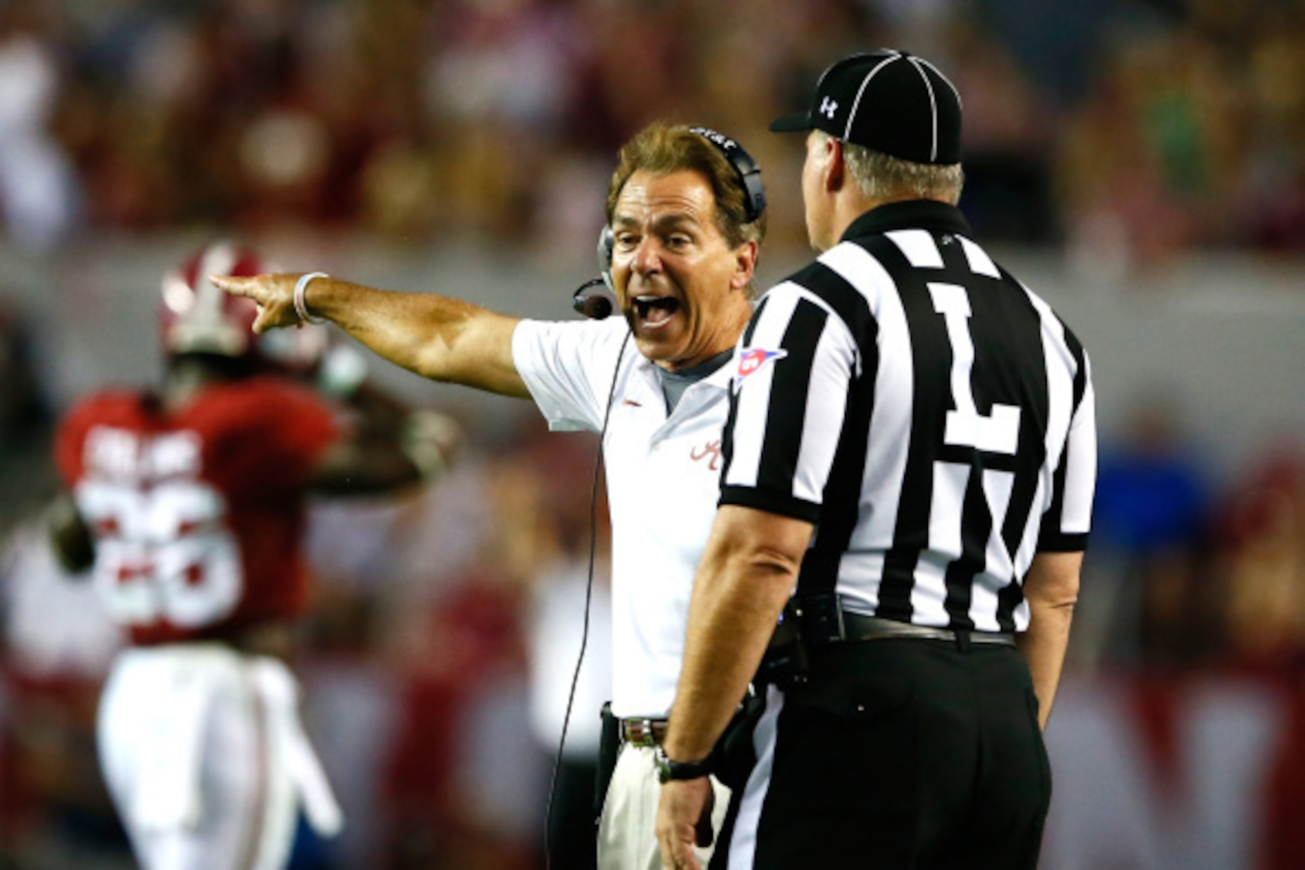 TUSCALOOSA, AL - SEPTEMBER 13:  Head coach Nick Saban of the Alabama Crimson Tide yells to line judge Michael Taylor during the game against the Southern Miss Golden Eagles at Bryant-Denny Stadium on September 13, 2014 in Tuscaloosa, Alabama.  (Photo by K