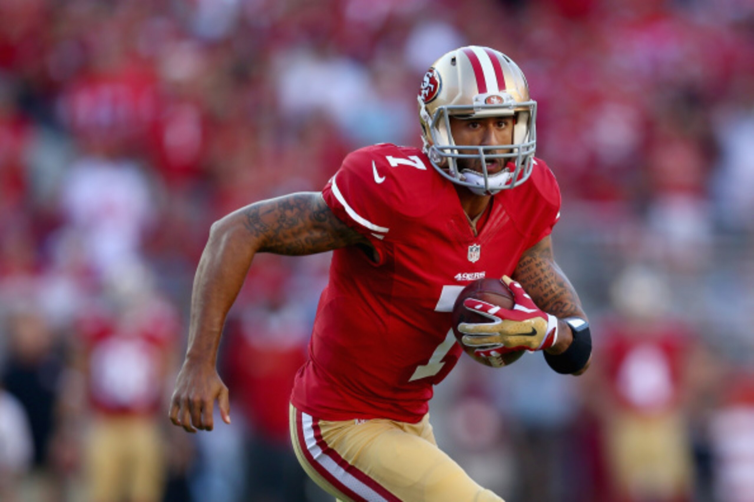 SANTA CLARA, CA - SEPTEMBER 14:  Quarterback Colin Kaepernick #7 of the San Francisco 49ers carries the ball against the Chicago Bears at Levi's Stadium on September 14, 2014 in Santa Clara, California.  (Photo by Jeff Gross/Getty Images)