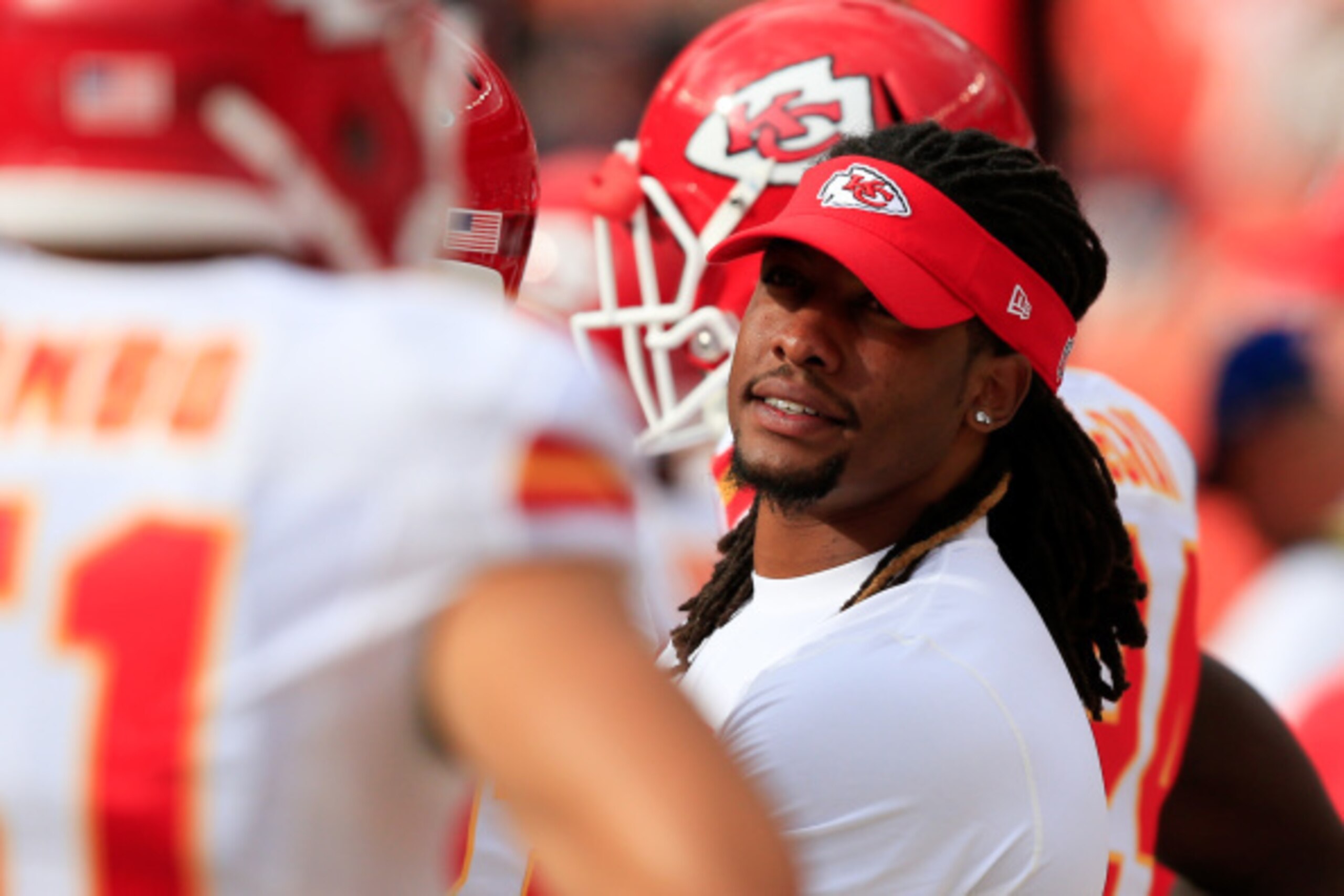 DENVER, CO - SEPTEMBER 14:  Running back Jamaal Charles #25 of the Kansas City Chiefs talks to teammates on the sideline after coming out of a game against the Denver Broncos with an apparent ankle injury at Sports Authority Field at Mile High on Septembe