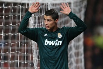 MANCHESTER, ENGLAND - MARCH 05:  Cristiano Ronaldo of Real Madrid reacts after scoring his team's second goal during the UEFA Champions League Round of 16 Second leg match between Manchester United and Real Madrid at Old Trafford on March 5, 2013 in Manch