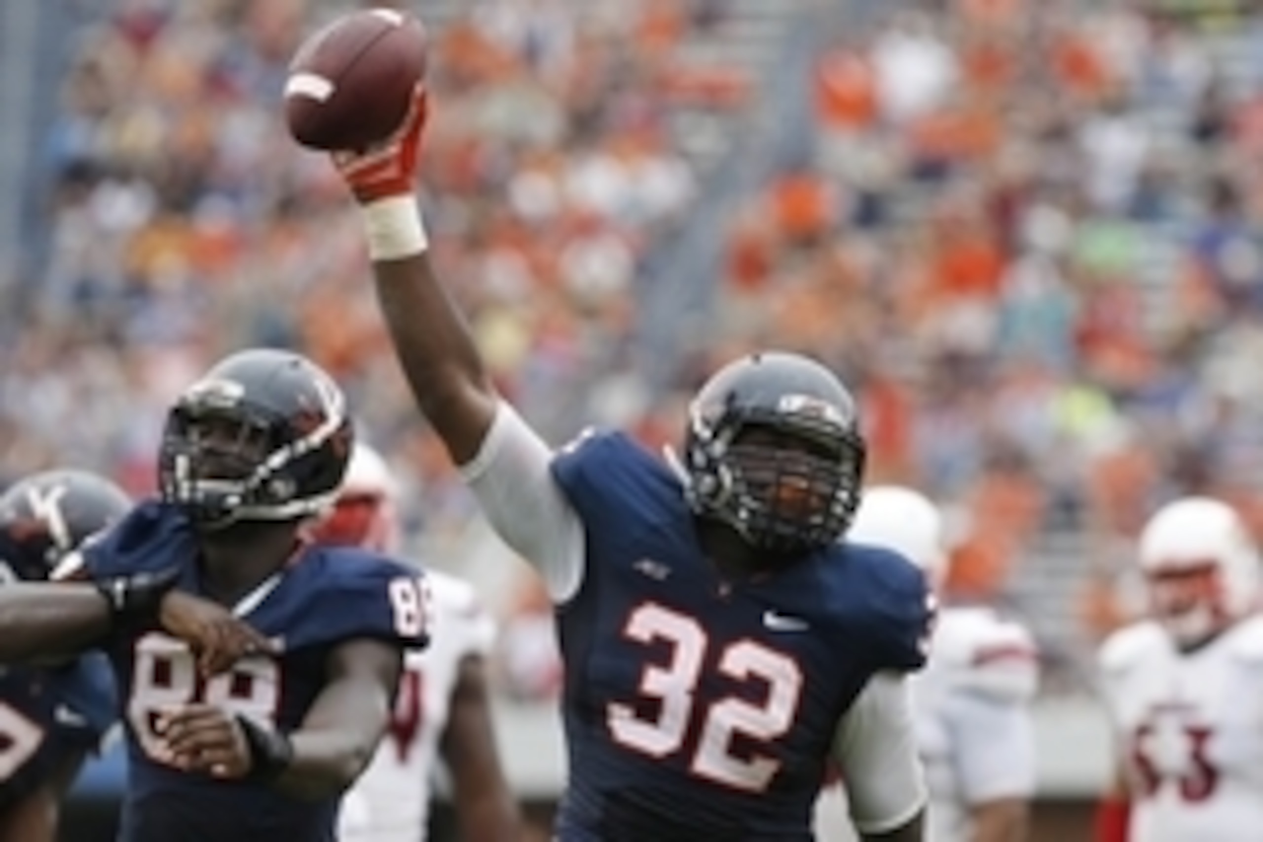 Sep 13, 2014; Charlottesville, VA, USA; Virginia Cavaliers defensive end Mike Moore (32) celebrates after recovering a fumble against the Louisville Cardinals in the second quarter at Scott Stadium. Mandatory Credit: Geoff Burke-USA TODAY Sports