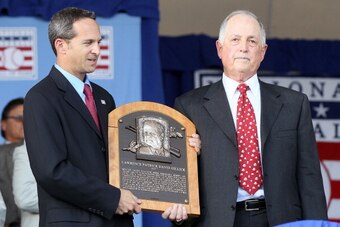 COOPERSTOWN, NY - JULY 24:  Pat Gillick accepts his plaque from Hall of Fame president Jeff Idelson at Clark Sports Center during the Baseball Hall of Fame induction ceremony on July 24, 2011 in Cooperstown, New York.Gillick spent 27 years as the general