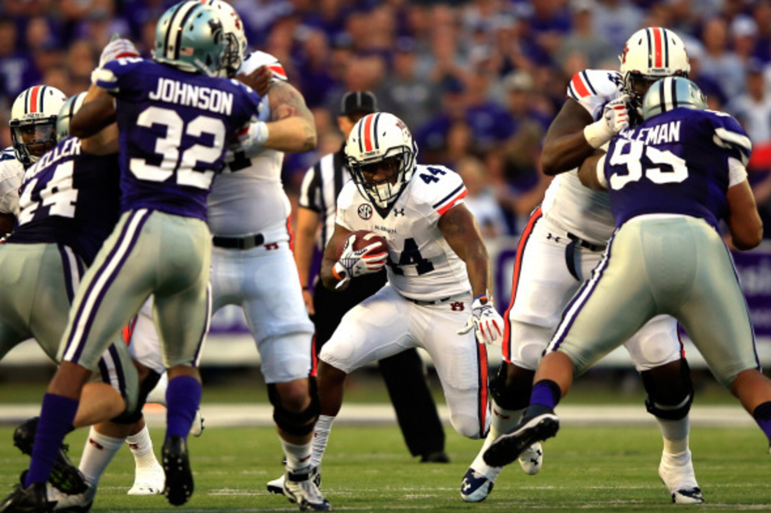 MANHATTAN, KS - SEPTEMBER 18:  Running back Cameron Artis-Payne #44 of the Auburn Tigers carries the ball during the game against the Kansas State Wildcats at Bill Snyder Family Football Stadium on September 18, 2014 in Manhattan, Kansas.  (Photo by Jamie
