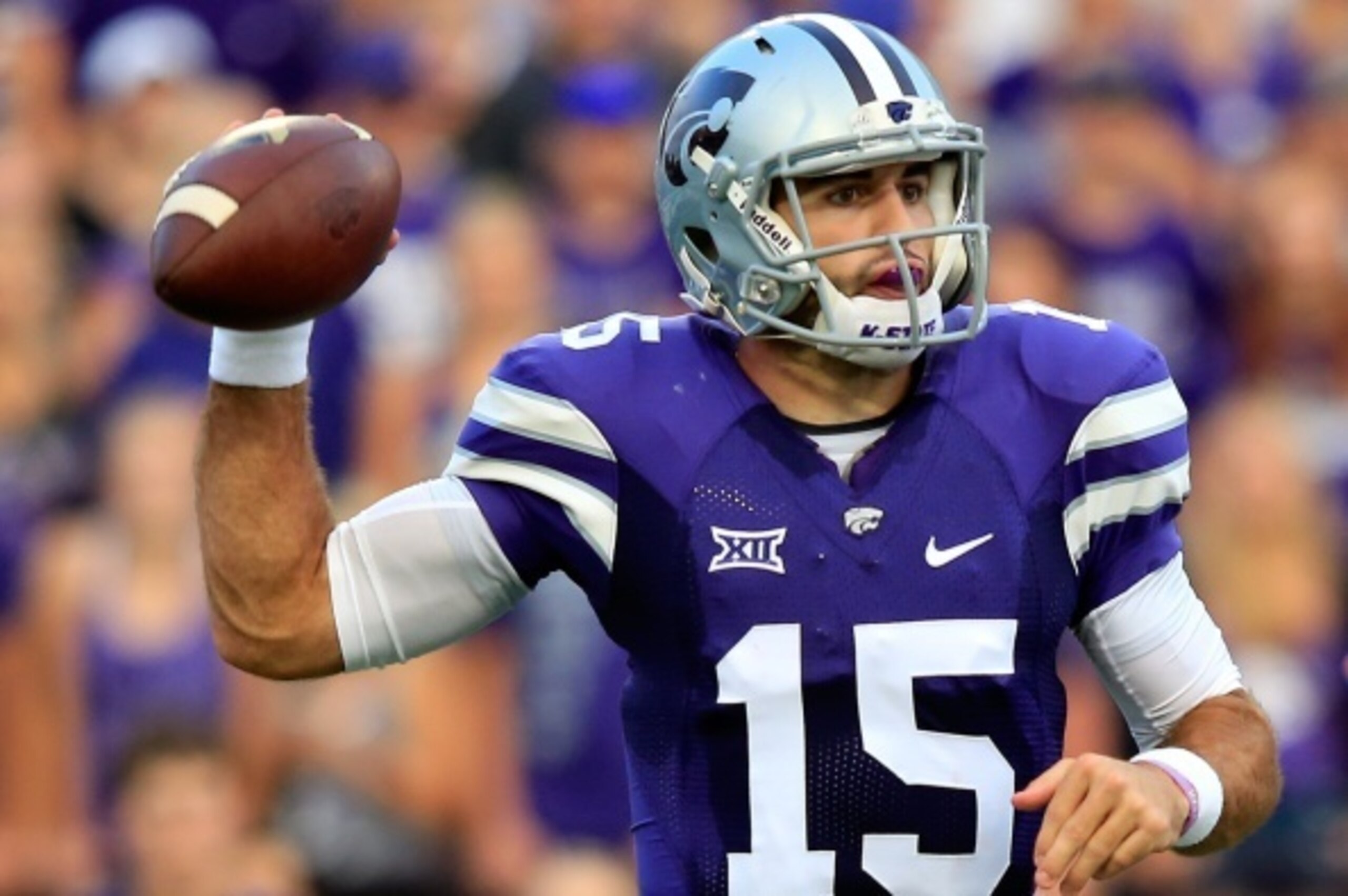 MANHATTAN, KS - SEPTEMBER 18:  Quarterback Jake Waters #15 of the Kansas State Wildcats passes during the game against the Auburn Tigers at Bill Snyder Family Football Stadium on September 18, 2014 in Manhattan, Kansas.  (Photo by Jamie Squire/Getty Image