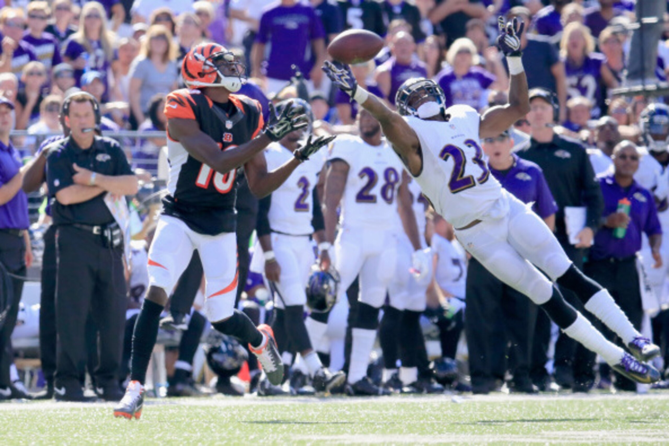 BALTIMORE, MD - SEPTEMBER 07:  Wide receiver A.J. Green #18 of the Cincinnati Bengals catches a touchdown pass in front of defensive back Chykie Brown #23 of the Baltimore Ravens during the second half of an NFL football game against the Baltimore Ravens 