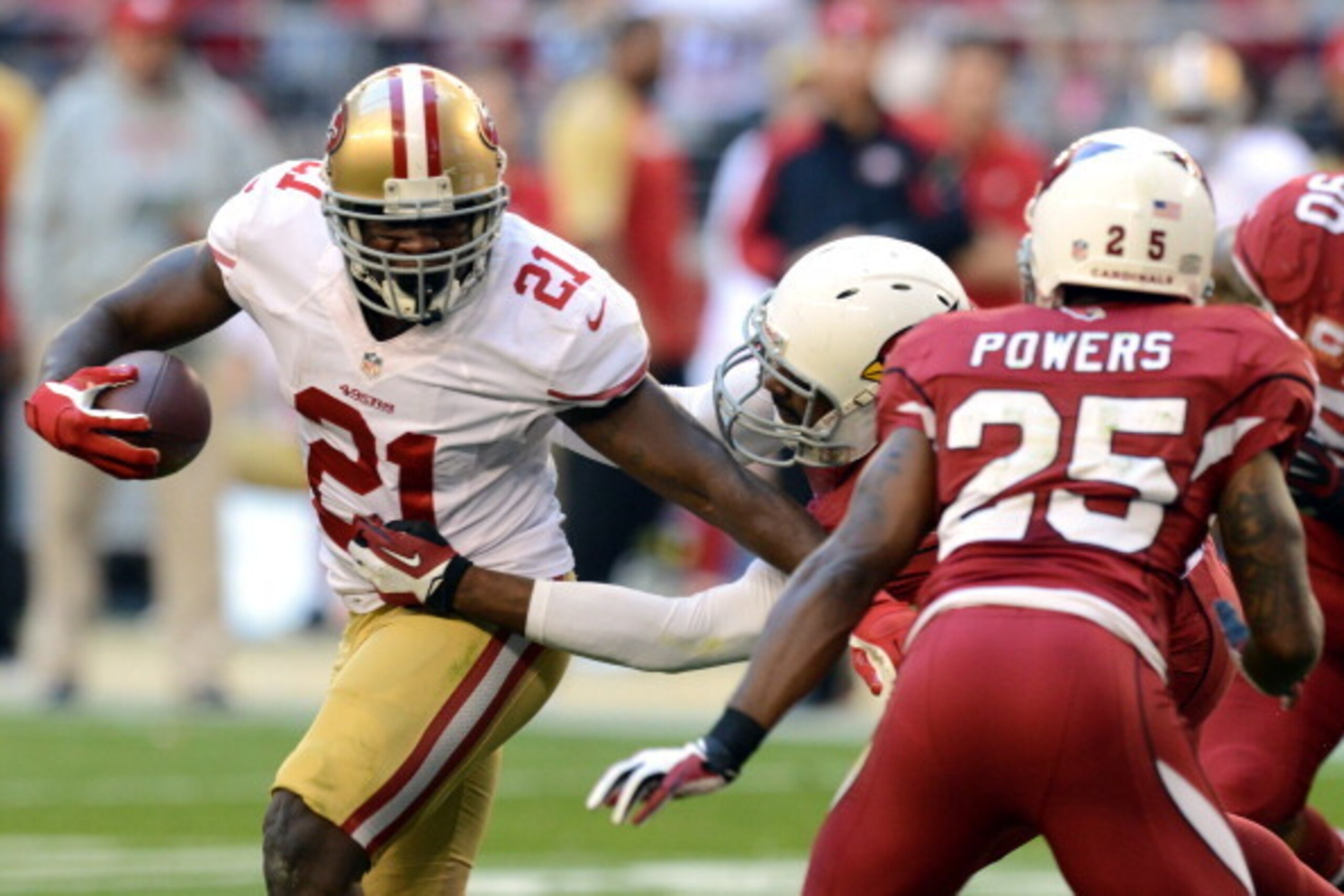 GLENDALE, AZ - DECEMBER 29:  Frank Gore #21 of the San Francisco 49ers runs the ball against the Arizona Cardinals during a game at University of Phoenix Stadium on December 29, 2013 in Glendale, Arizona.  (Photo by Norm Hall/Getty Images)