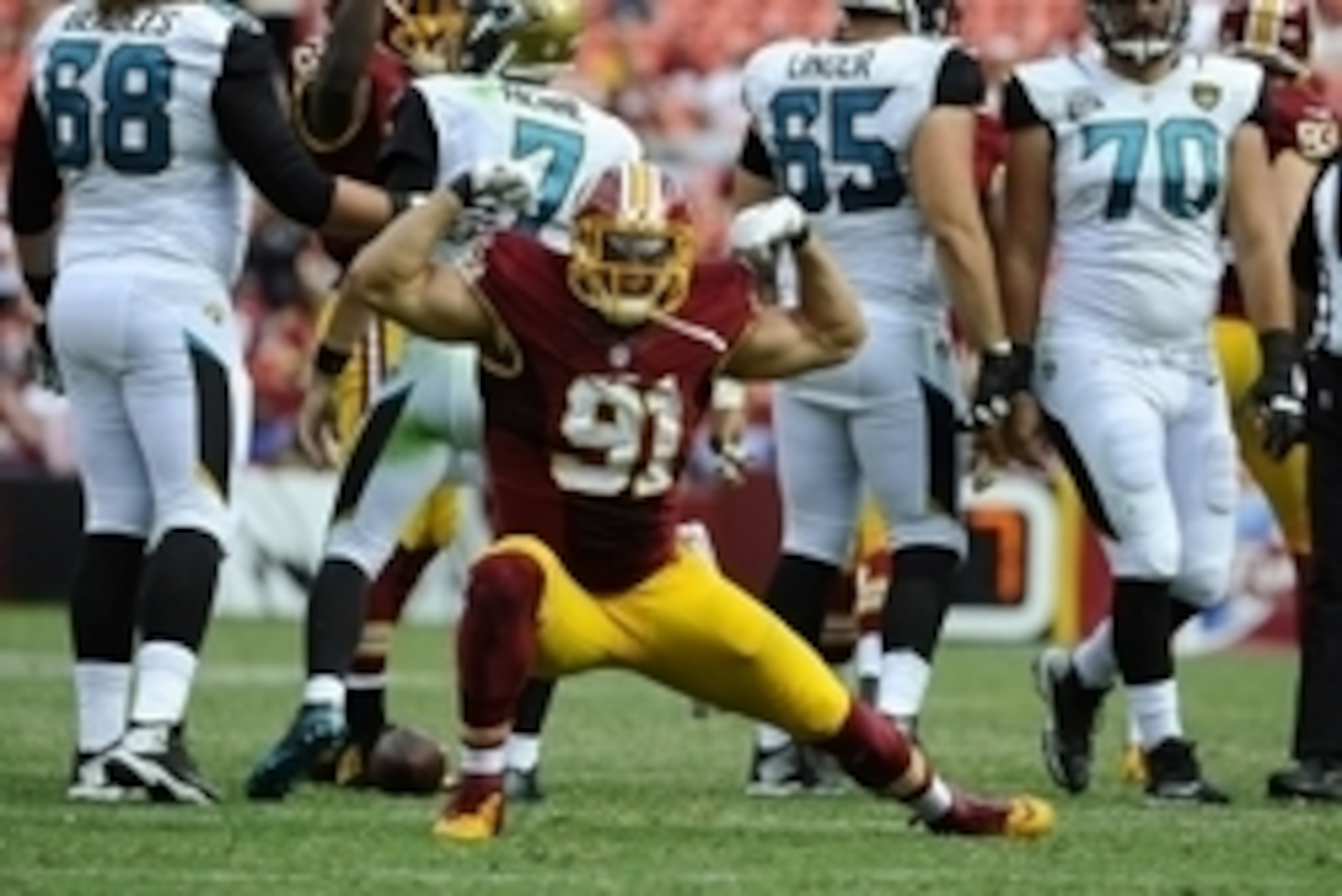 Sep 14, 2014; Landover, MD, USA; Washington Redskins linebacker Ryan Kerrigan (91) celebrates after sacking Jacksonville Jaguars quarterback Chad Henne (7) during the second half at FedEx Field. Mandatory Credit: Brad Mills-USA TODAY Sports