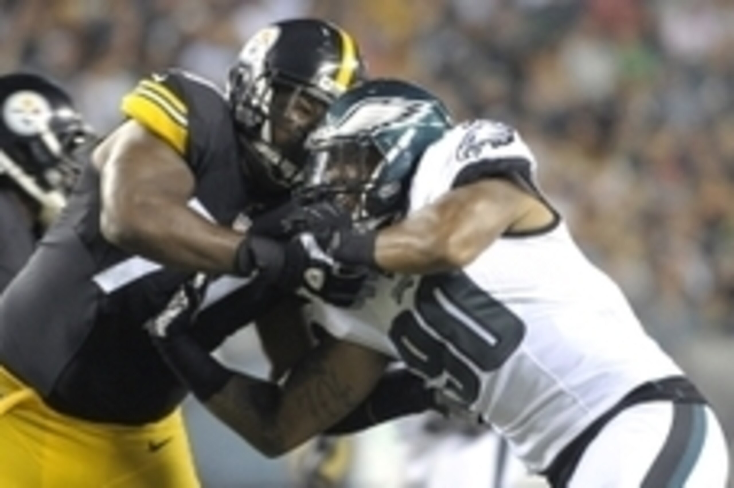 Aug 21, 2014; Philadelphia, PA, USA; Philadelphia Eagles linebacker Marcus Smith (90) and Pittsburgh Steelers tackle Marcus Gilbert (77) battle during the second quarter at Lincoln Financial Field. The Eagles defeated the Steelers, 31-21.  Mandatory Credi