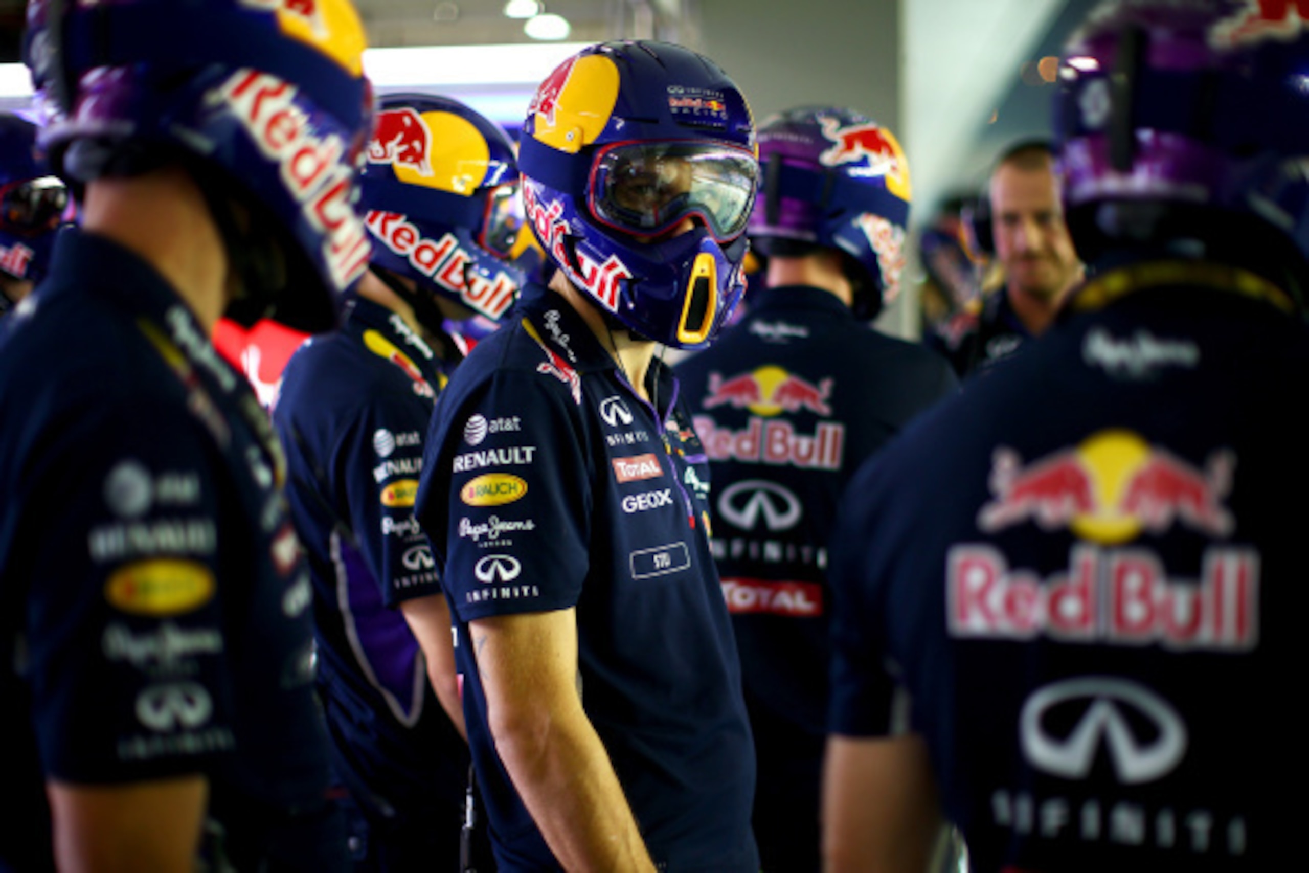SINGAPORE - SEPTEMBER 18:  Members of the Infiniti Red Bull Racing team prepare to take part in a pit stop practice session during previews ahead of the Singapore Formula One Grand Prix at Marina Bay Street Circuit on September 18, 2014 in Singapore, Sing