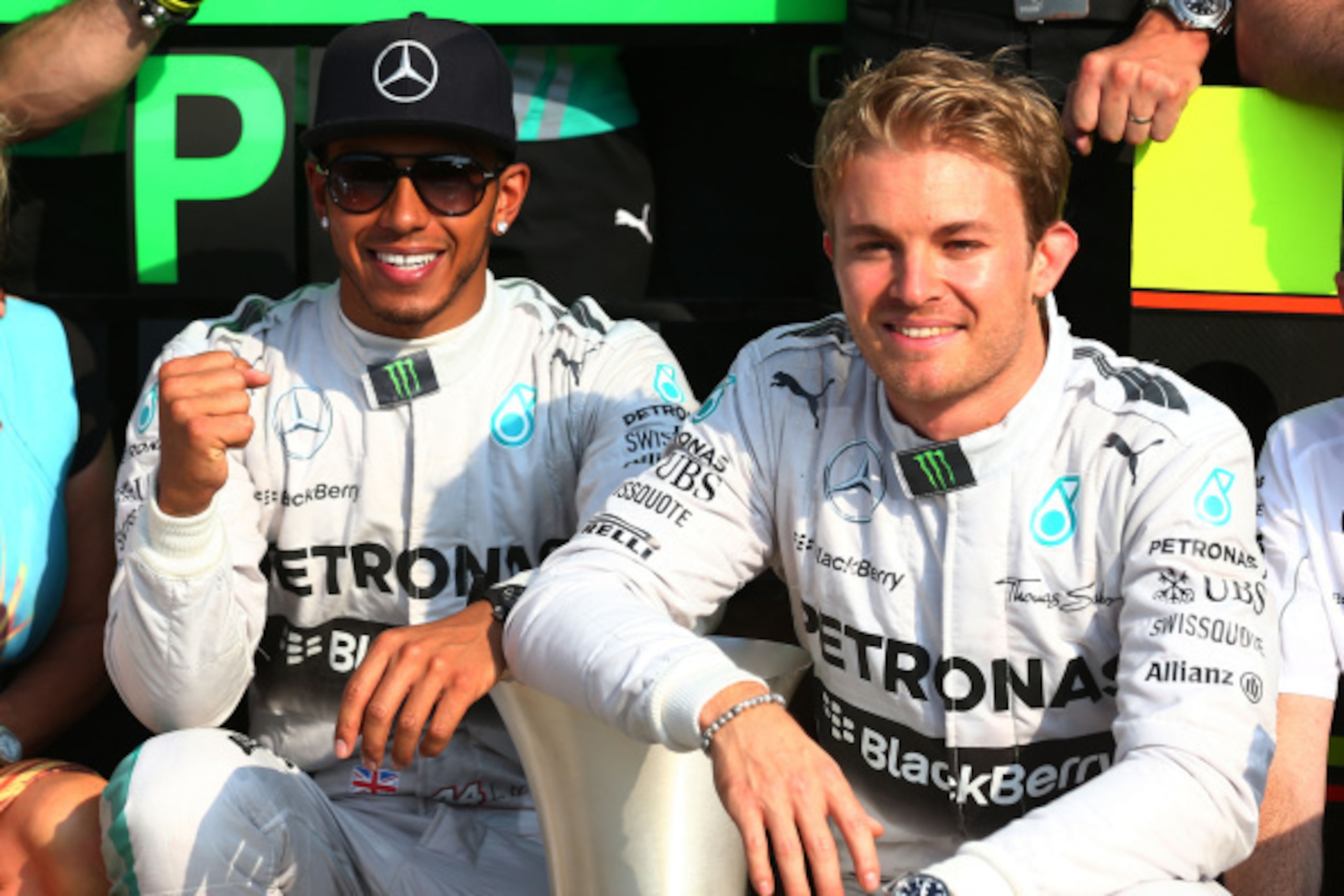 MONZA, ITALY - SEPTEMBER 07:  (L-R) Race winner Lewis Hamilton of Great Britain and Mercedes GP and second placed Nico Rosberg of Germany and Mercedes GP celebrate following the F1 Grand Prix of Italy at Autodromo di Monza on September 7, 2014 in Monza, I