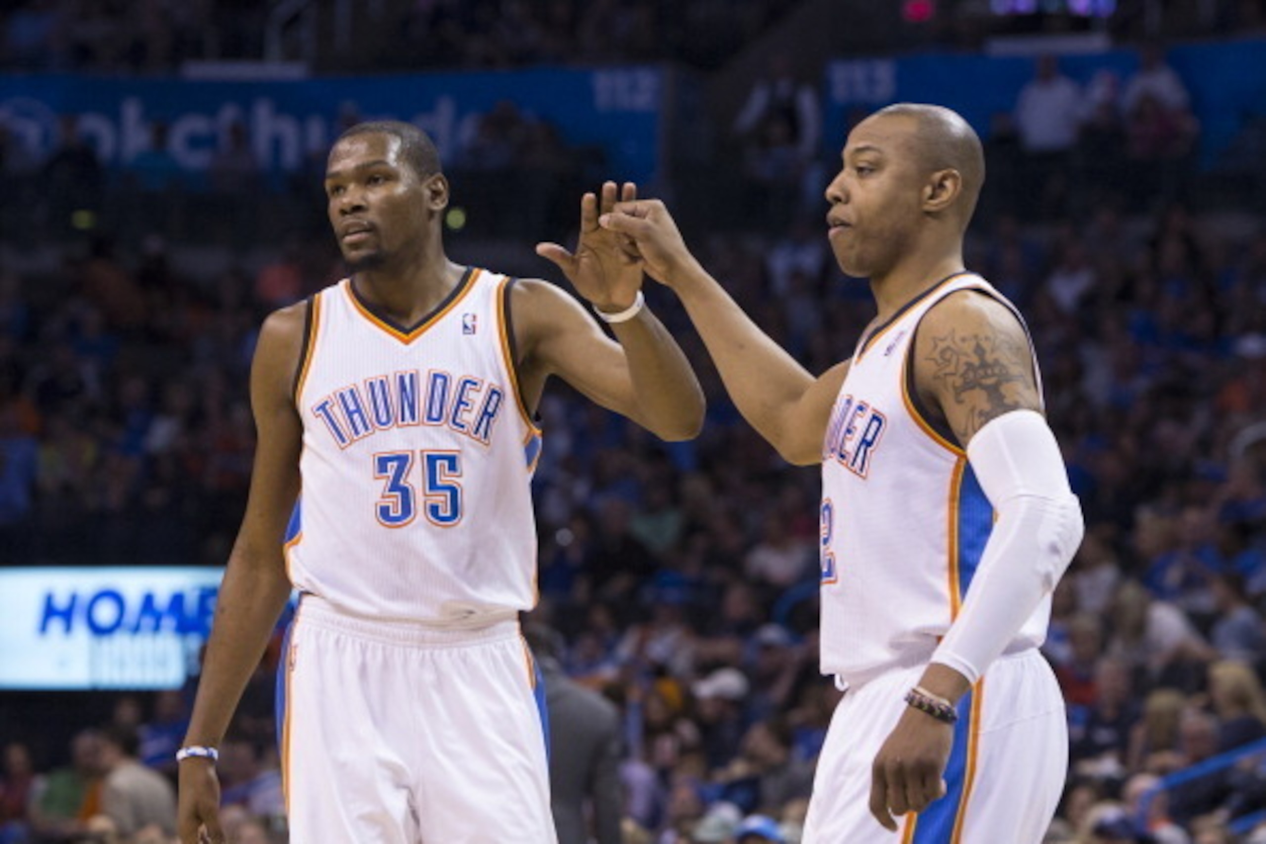 OKLAHOMA CITY, OK - MARCH 30:  Kevin Durant #35 and Caron Butler #2 of the Oklahoma City Thunder high five during the game against the Utah Jazz at the Chesapeake Arena on March 30, 2014 in Oklahoma City, Oklahoma. NOTE TO USER:  User expressly acknowledg