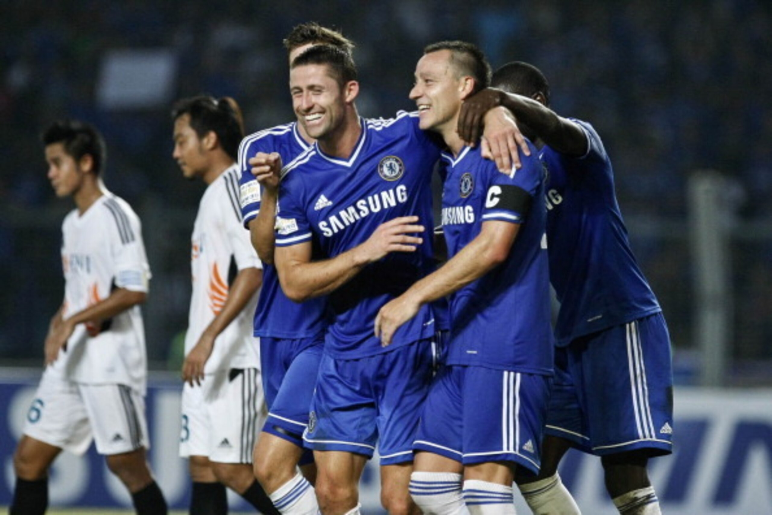 JAKARTA, INDONESIA - JULY 25:  John Terry (R) of Chelsea celebrates his goal with Gary Cahill during the match between Chelsea and Indonesia All-Stars at Gelora Bung Karno Stadium on July 25, 2013 in Jakarta, Indonesia.  (Photo by Ulet Ifansasti/Getty Ima